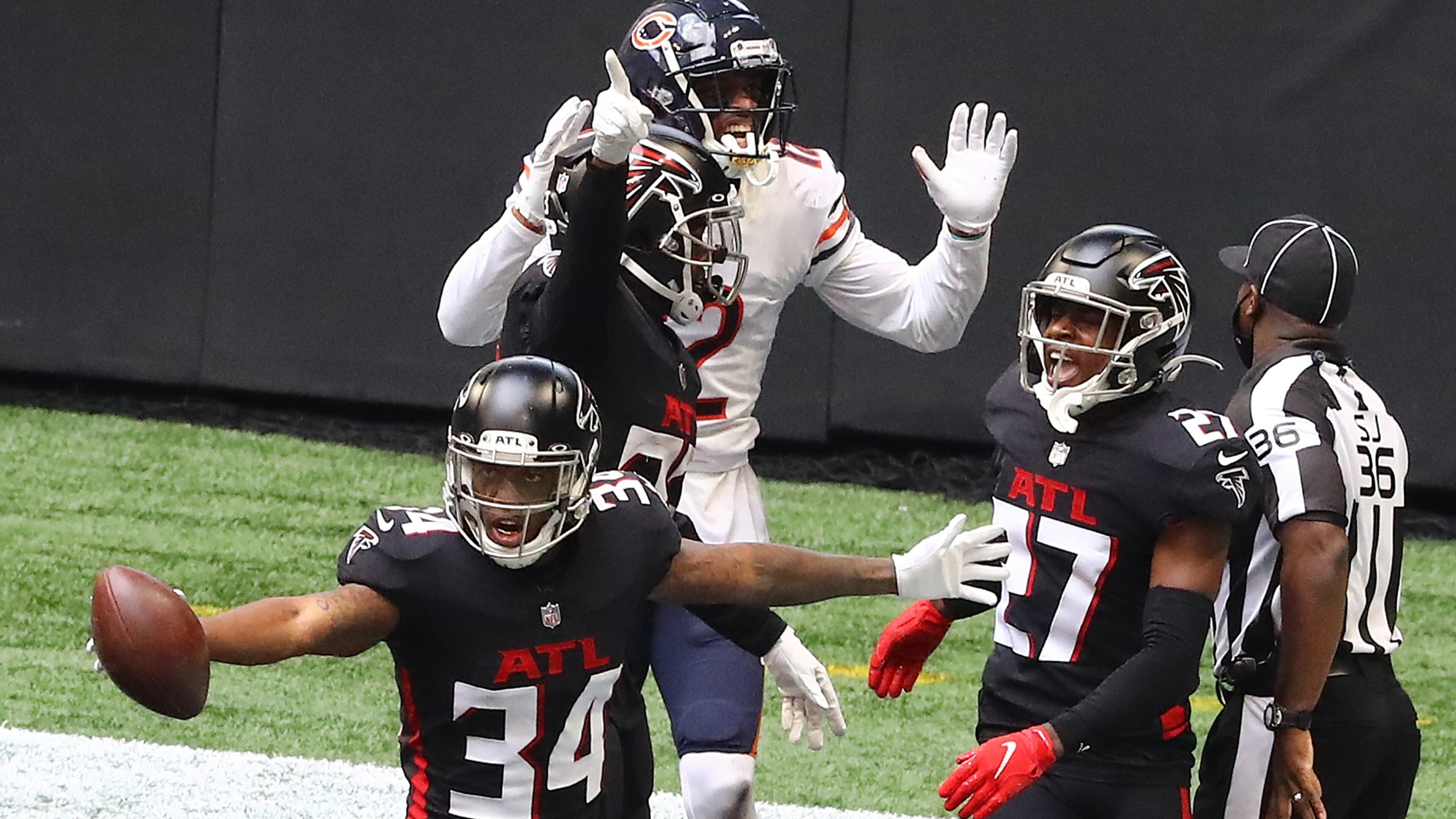 Falcons cornerback Darqueze Dennard gets the interception in the end zone against Chicago Bears wide receiver Allen Robinson during the third quarter Sunday, Sept. 27, 2020, in Atlanta. (Curtis Compton / Curtis.Compton@ajc.com)