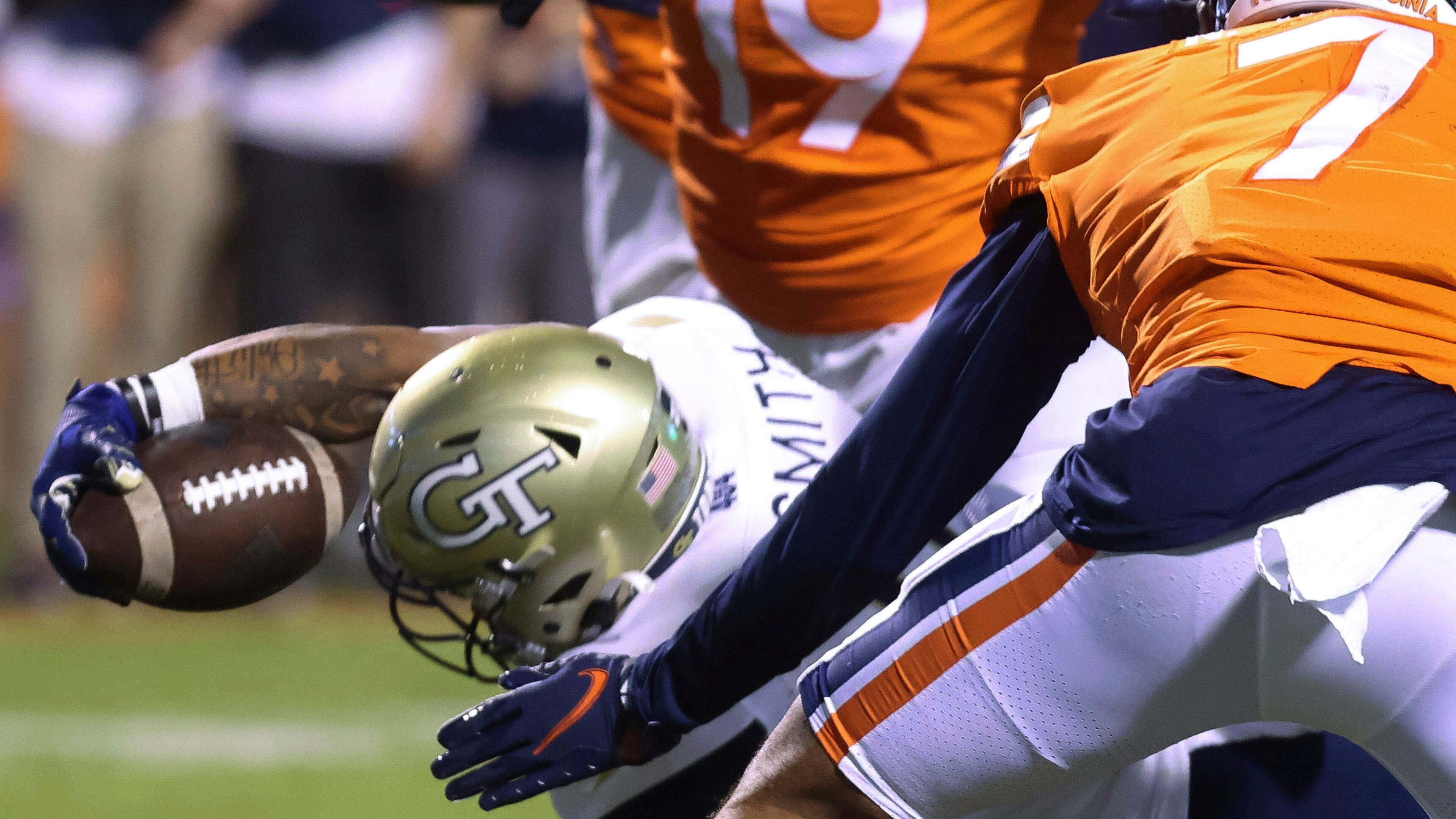 Georgia Tech running back Dontae Smith (4) reaches out for the touchdown next to Virginia outside linebacker Noah Taylor (7) Saturday, Oct. 23, 2021, in Charlottesville, Va. (Andrew Shurtleff/The Daily Progress)