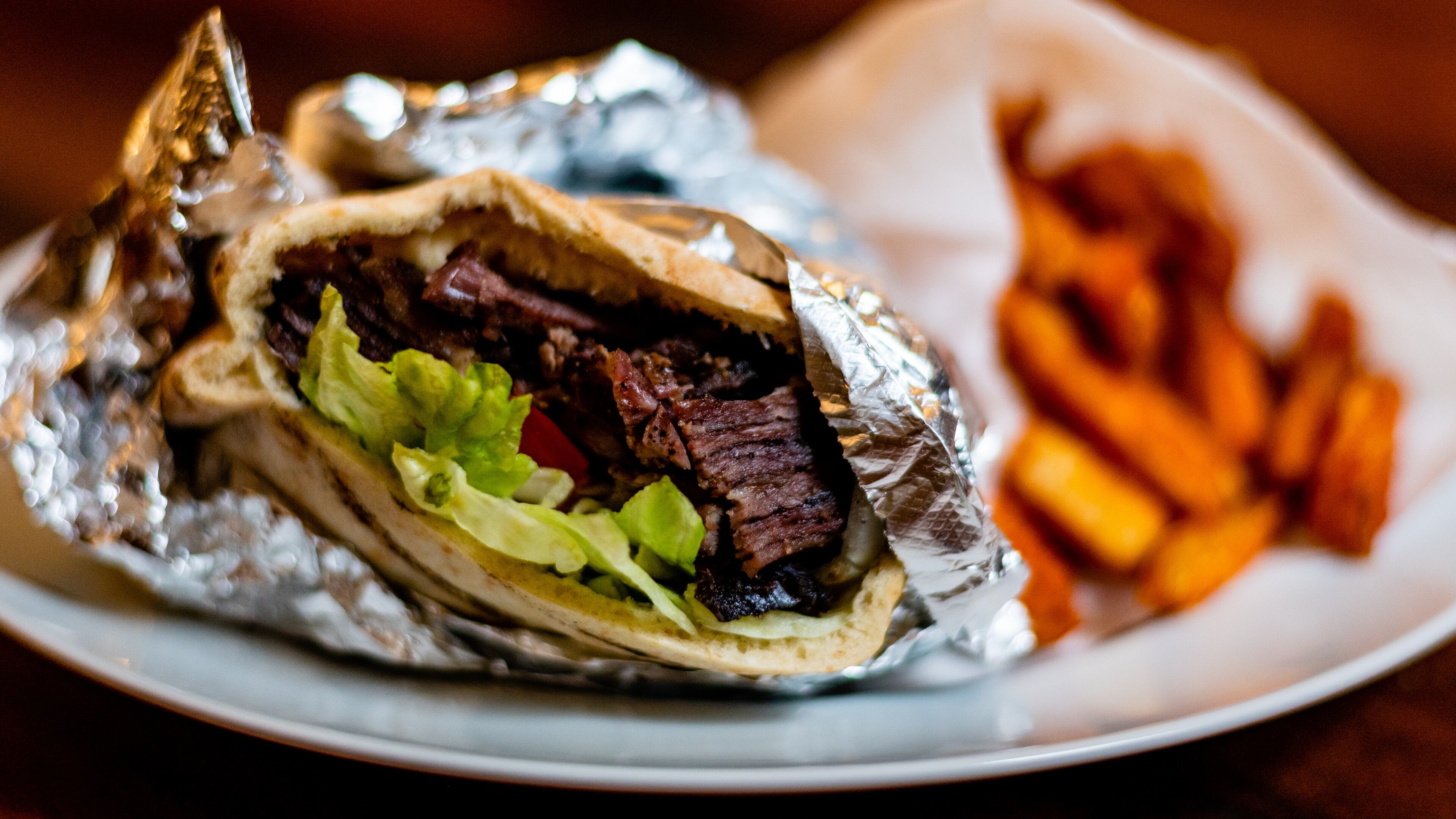 The MacDougal pita sandwich at Mamoun's Falafel contains both lamb shawarma and falafel.