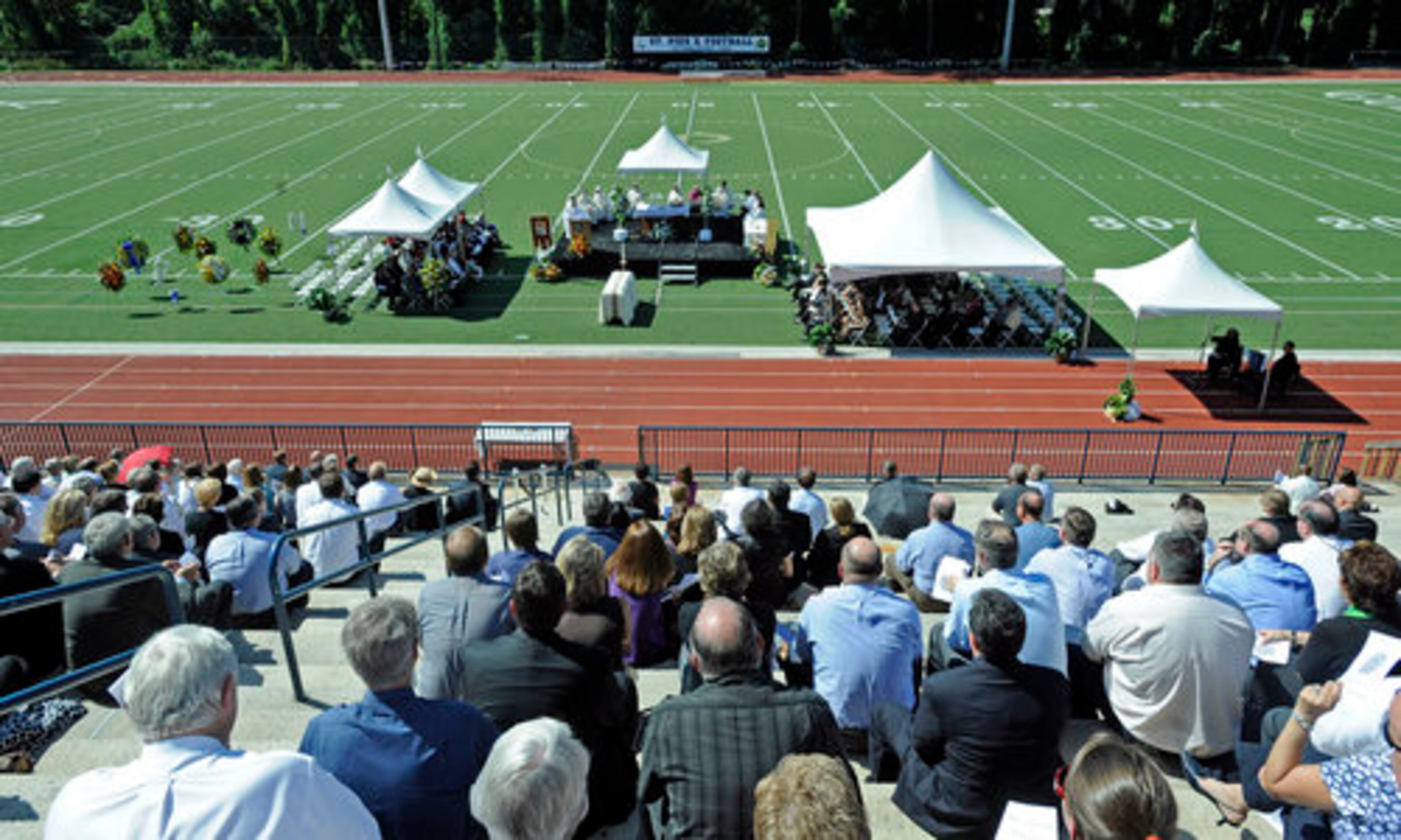 Hundreds gathered to remember Maloof at Thursday's memorial service at the football field at St. Pius X Catholic High School.