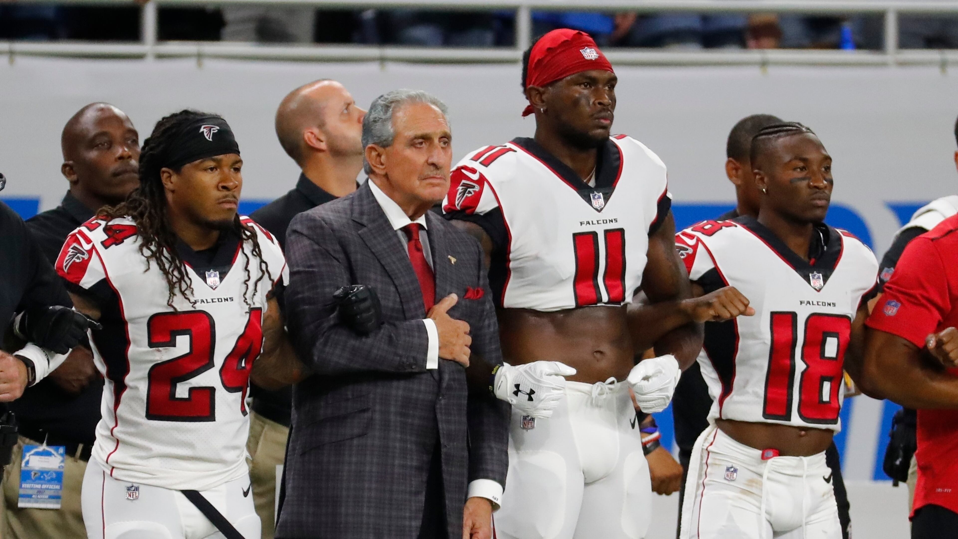 Atlanta Falcons owner Arthur Blank stands with his players during the national anthem before an NFL football game against the Detroit Lions, Sunday, Sept. 24, 2017, in Detroit. (AP Photo/Rick Osentoski)