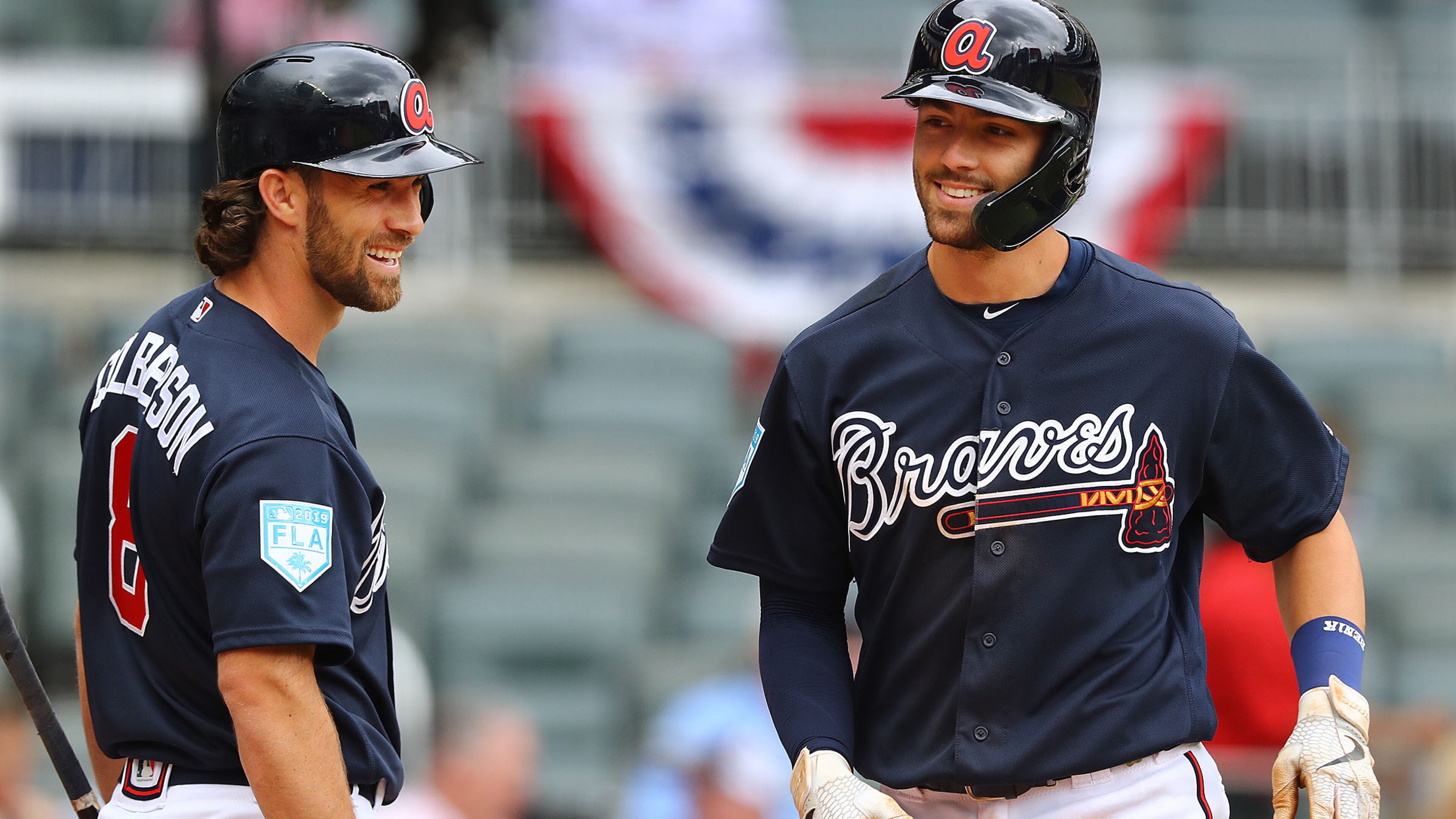 Braves infielder Dansby Swanson shares a smile with Charlie Culberson after hitting a 2-run homer to take a 3-2 lead over the Cincinnati Reds during the fifth inning of an exhibition game Tuesday, March 26, 2019, SunTrust Park in Atlanta.