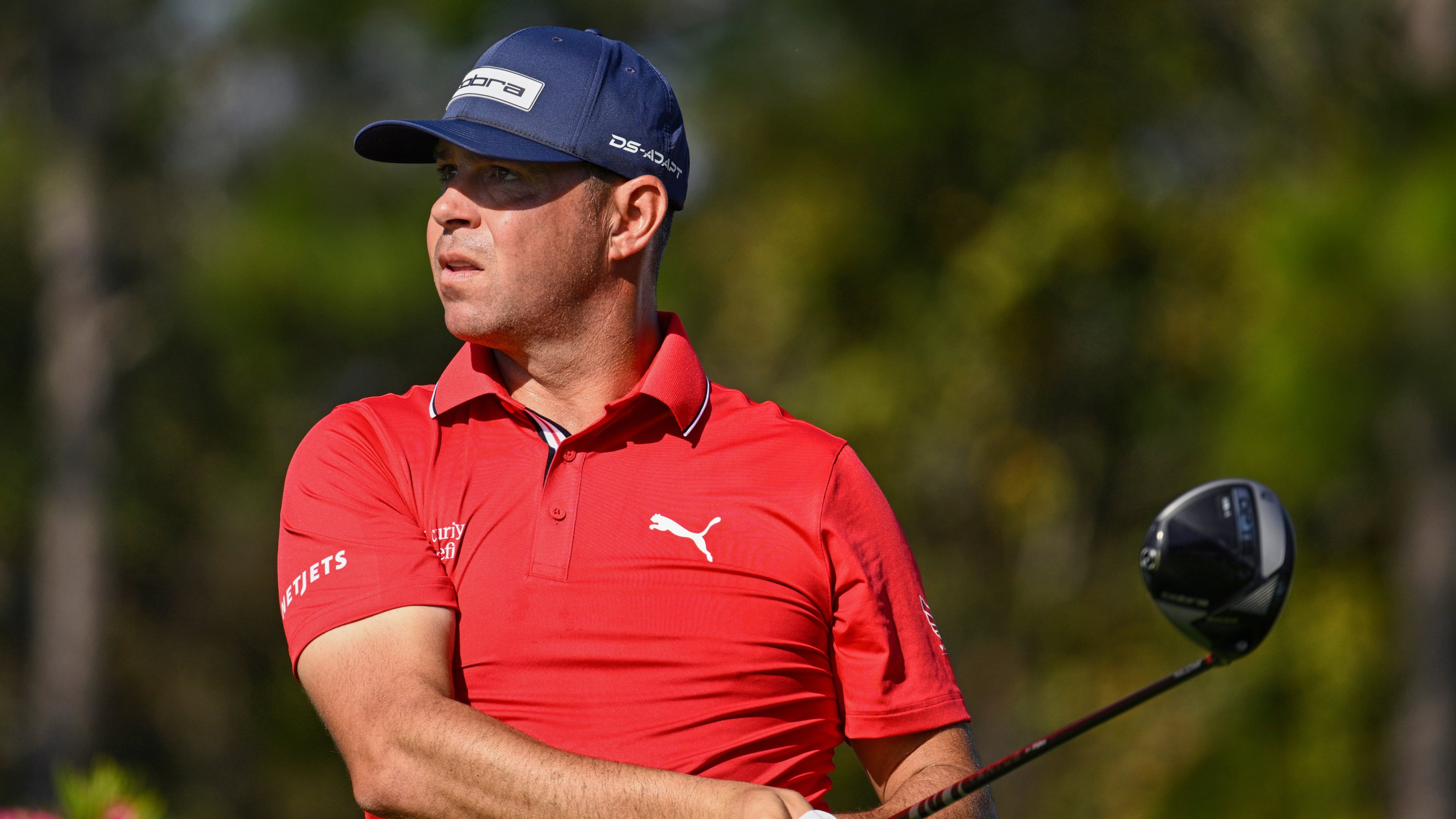 FILE - Gary Woodland looks on after hitting his tee shot on the second hole during the final round of the PNC Championship golf tournament, Dec. 21, 2025, in Orlando, Fla. (AP Photo/Phelan M. Ebenhack, File)