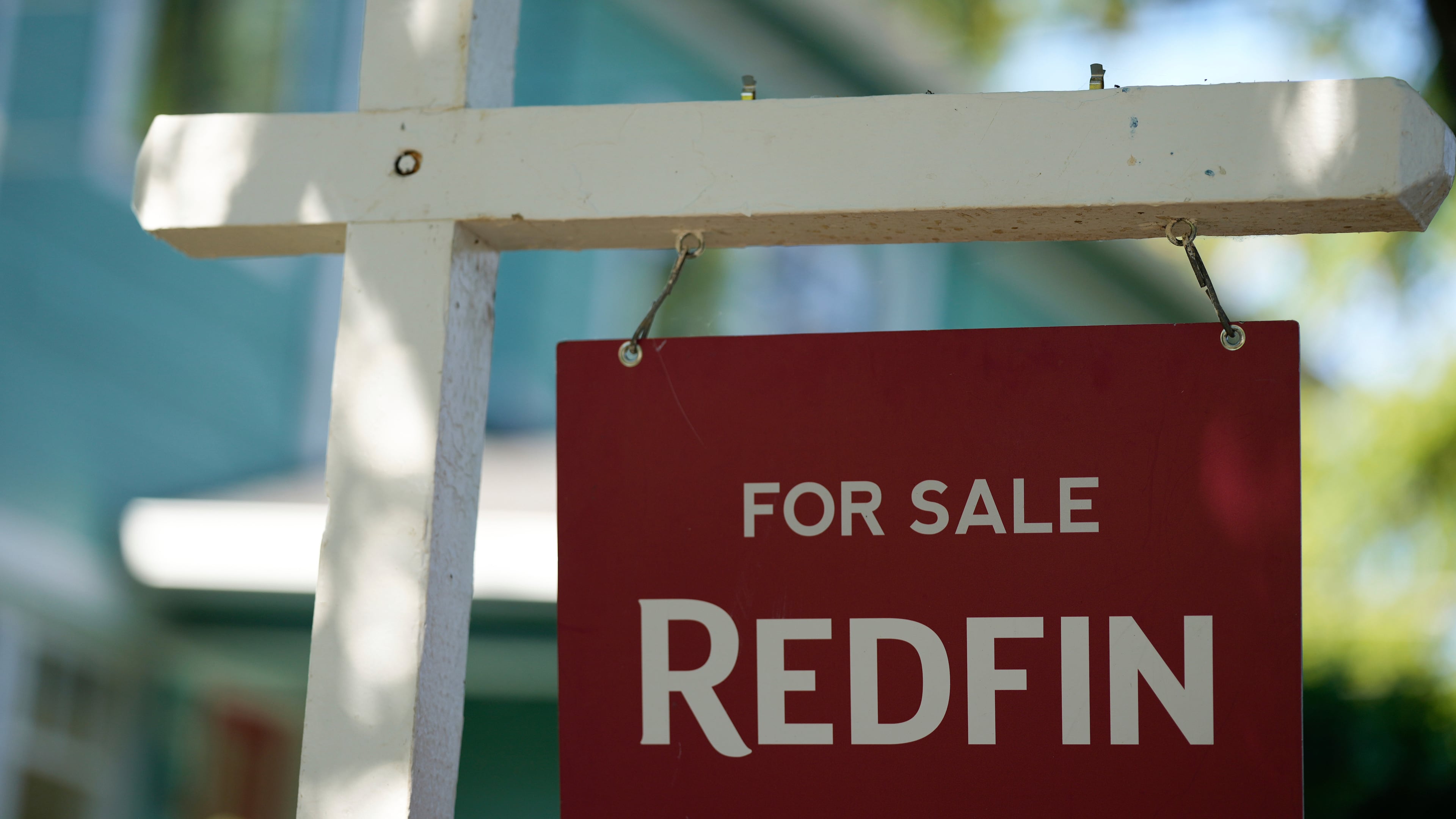FILE - A "For Sale" sign is displayed outside a home on Friday, July 11, 2025, in Portland, Ore. (AP Photo/Jenny Kane, File)