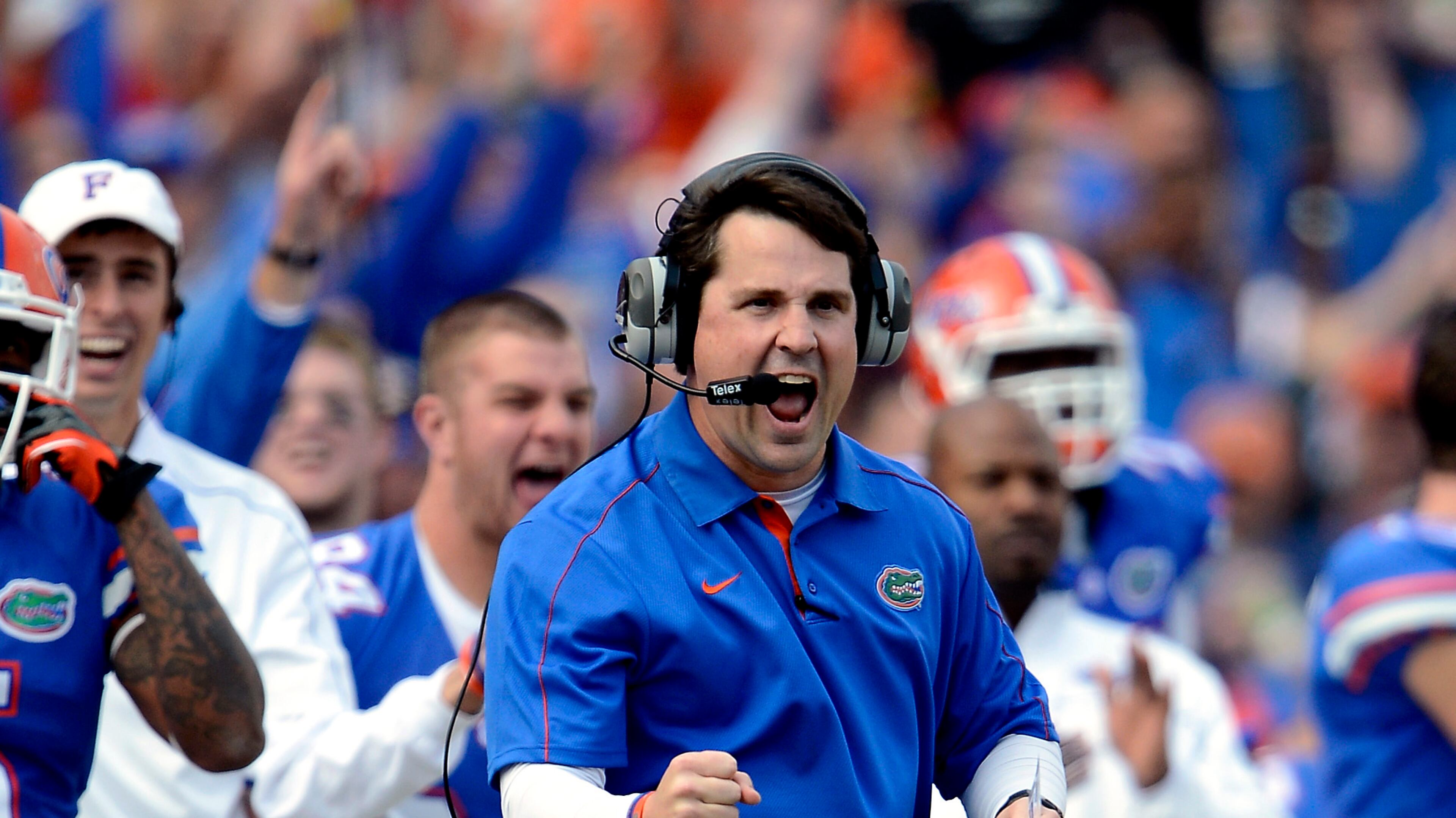 Florida head coach Will Muschamp celebrates a touchdown on an interception by linebacker Jon Bostic during the second half of an NCAA college football game against Jacksonville State on Saturday, Nov. 17, 2012, in Gainesville, Fla. Florida won the game 23-0. (AP Photo/Phil Sandlin)