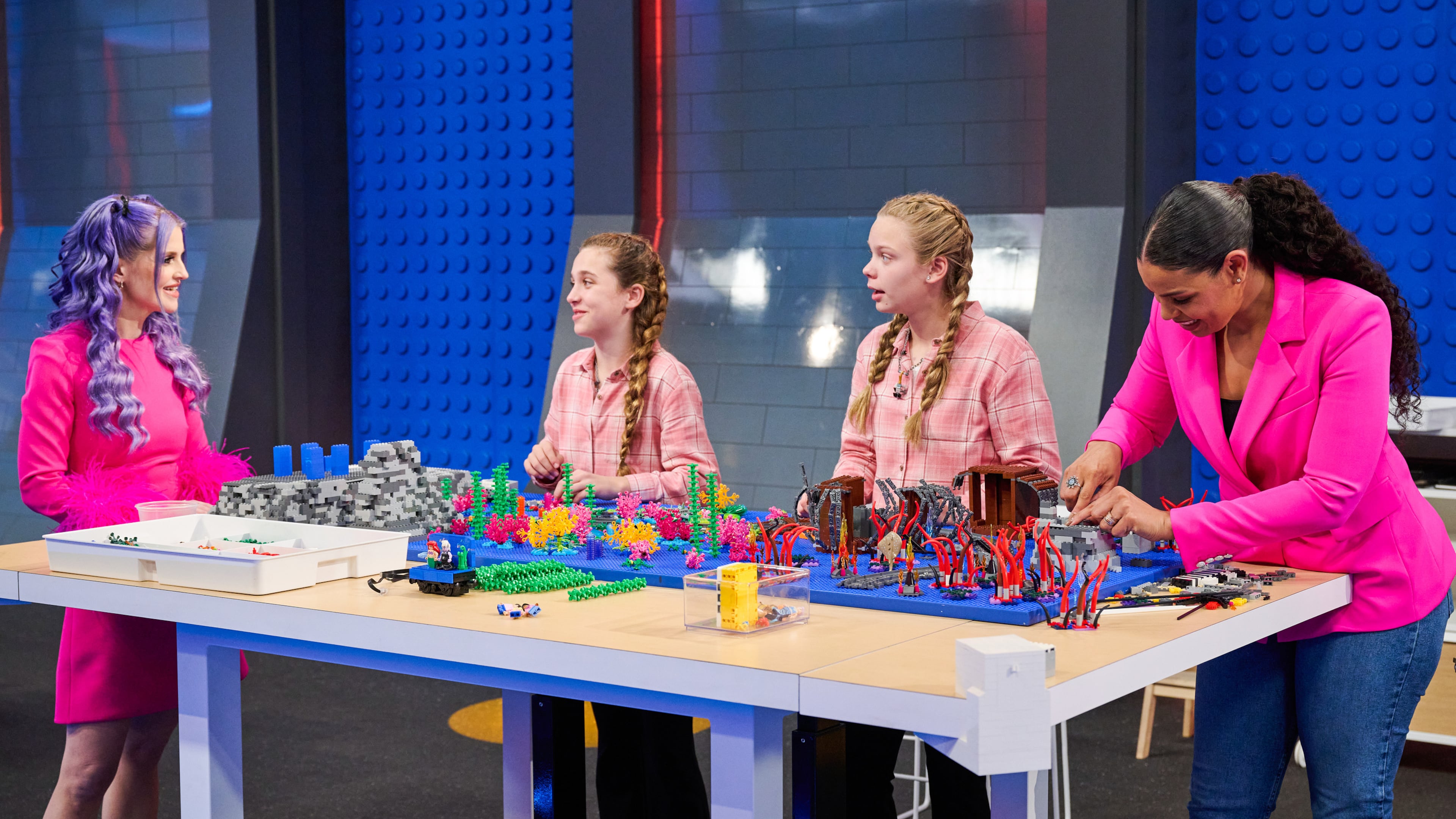 Host Kelly Osbourne (left) talks with contestants Stella and Chelle, and special guest Jordin Sparks in the “Lego Masters Jr.” series premiere episode "Disney Train Ride" airing Monday, Aug. 18 on Fox. (Tom Griscom/Fox Media LLC)