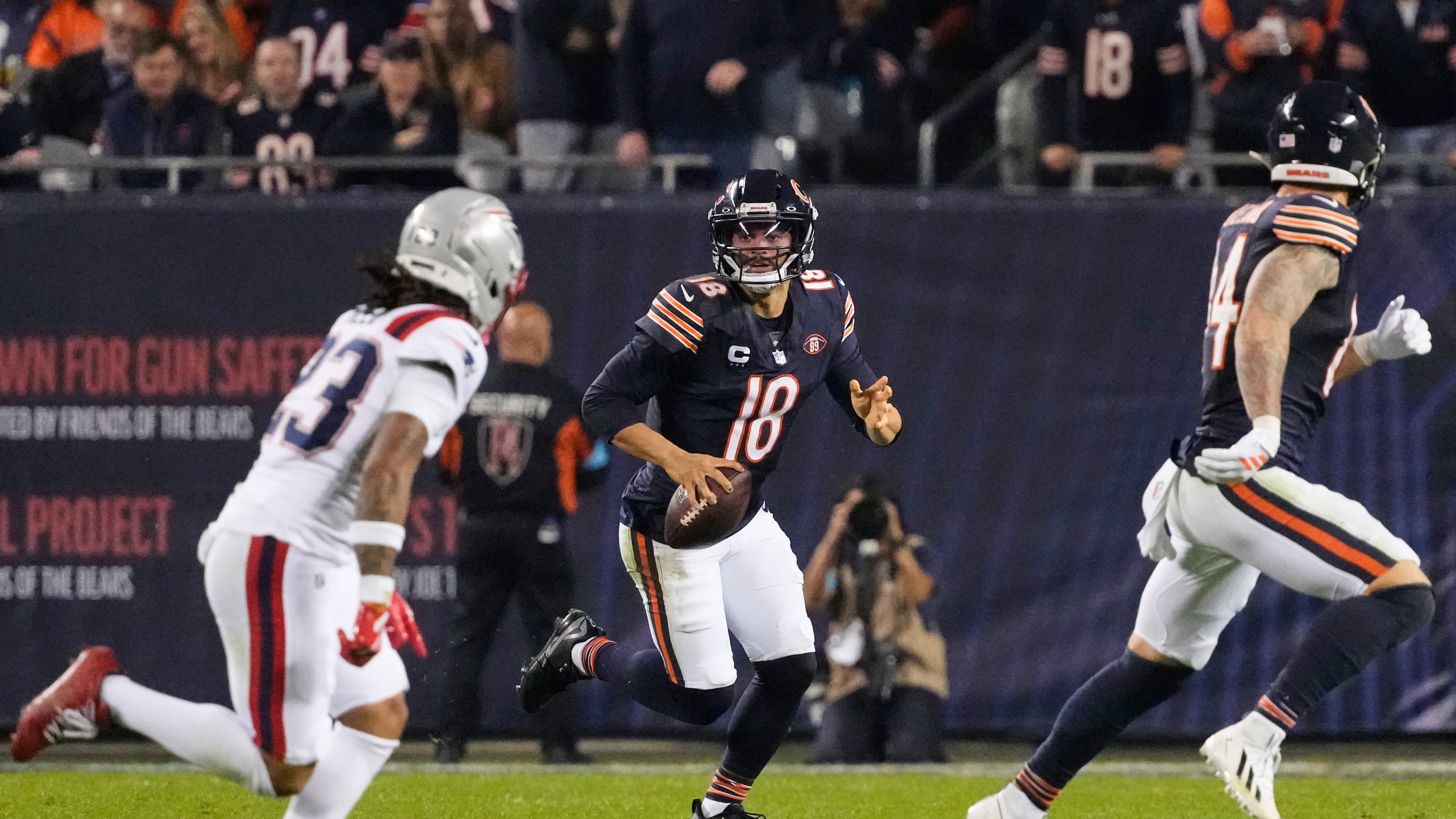 Chicago Bears quarterback Caleb Williams (18) scrambles as during the second half of an NFL football game against the New England Patriots in Chicago, Thursday, Oct. 22, 2026. (AP Photo/Nam Y. Huh)