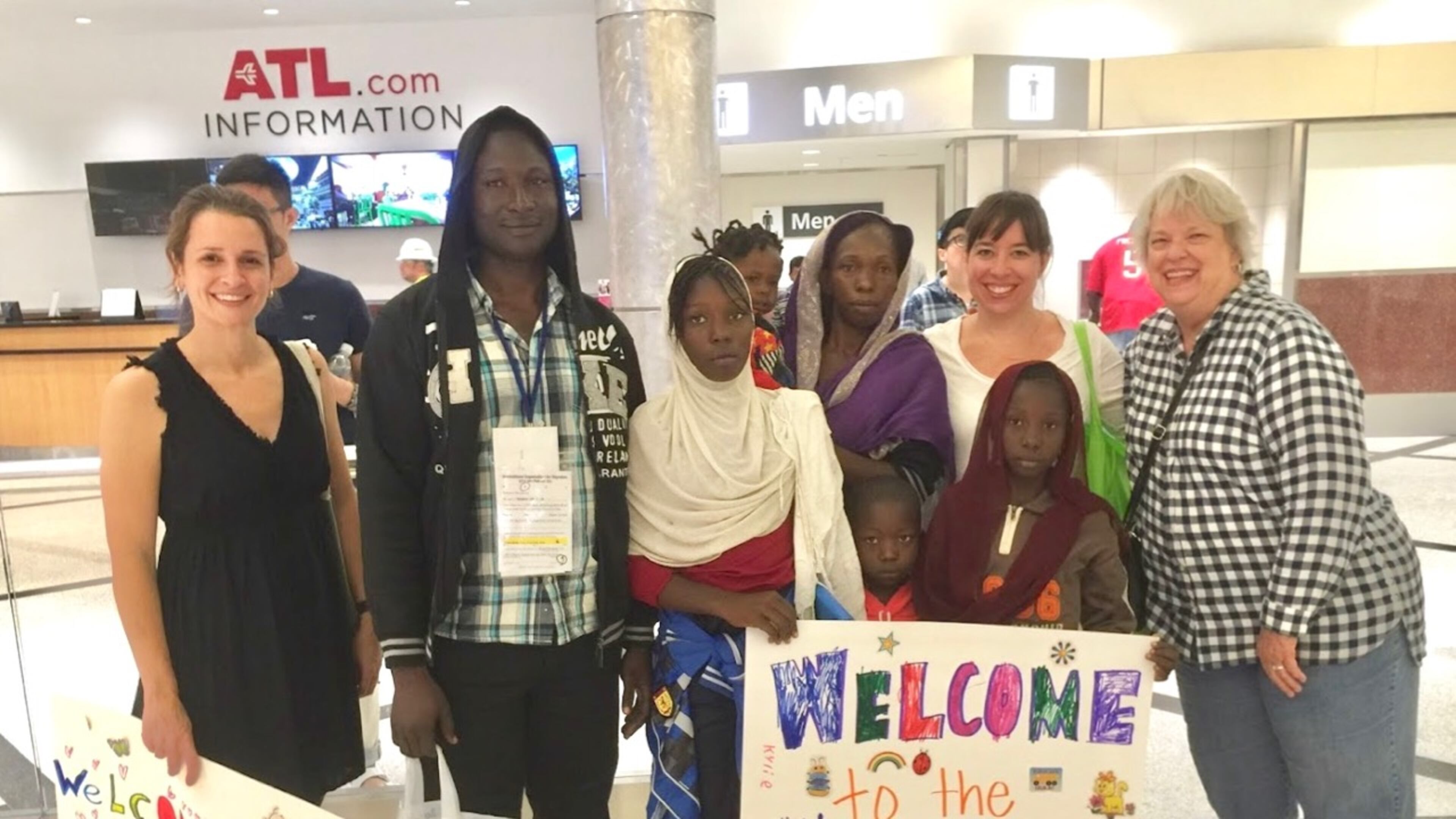 New Hope Baptist Church members Tina Ortkiese, Rebecca Bankey and Diana Evans welcomed a refugee family from Central African Republic as they arrived in Atlanta en route to resettlement in Clarkston. Photo courtesy of Rebecca Bankey