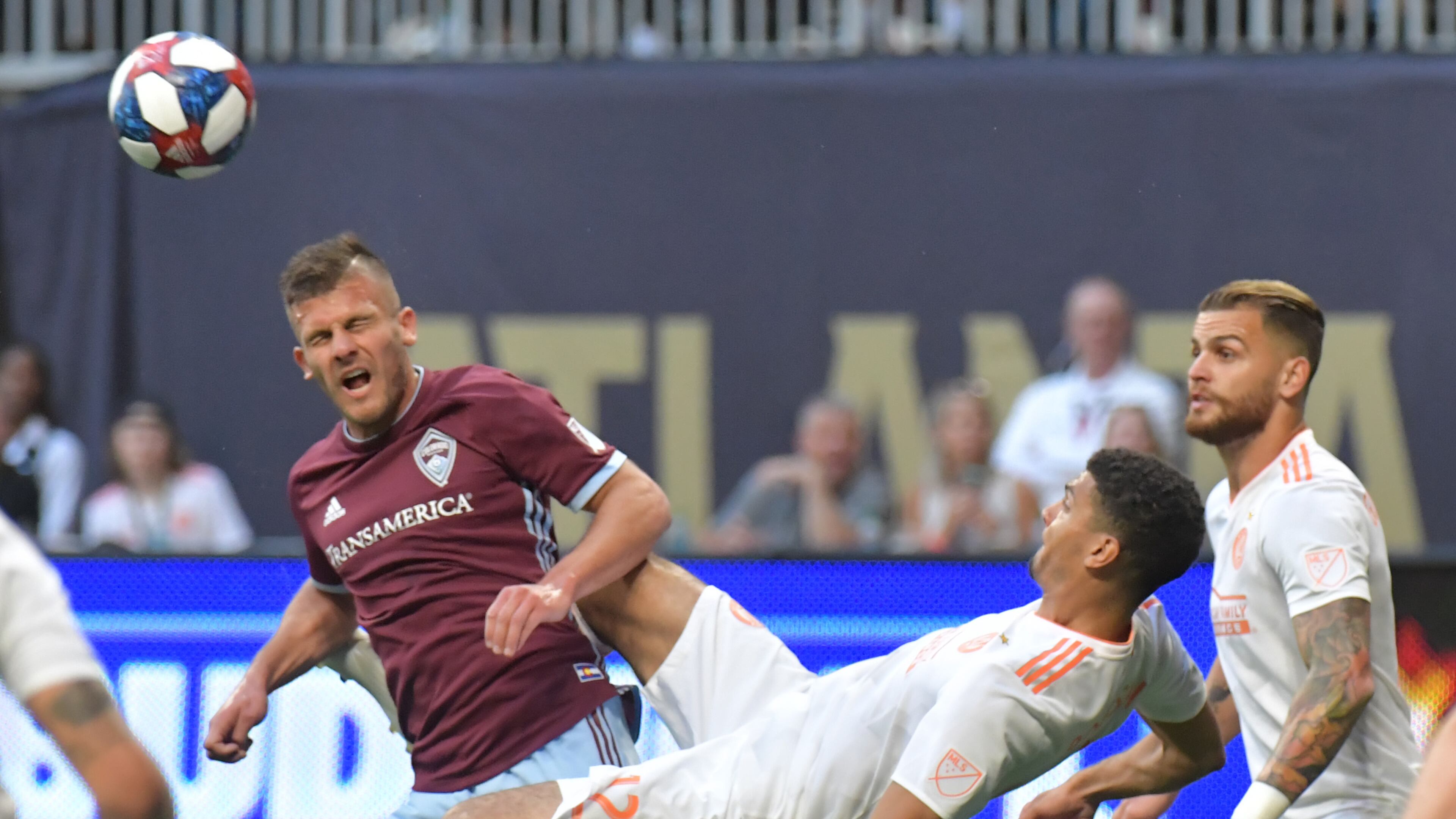 April 27, 2019 Atlanta - Atlanta United defender Miles Robinson (12) attempts a scissor kick against Colorado Rapids forward Diego Rubio (7) during the first half in a MLS soccer match at Mercedes-Benz Stadium in Atlanta on Saturday, April 27, 2019. HYOSUB SHIN / HSHIN@AJC.COM