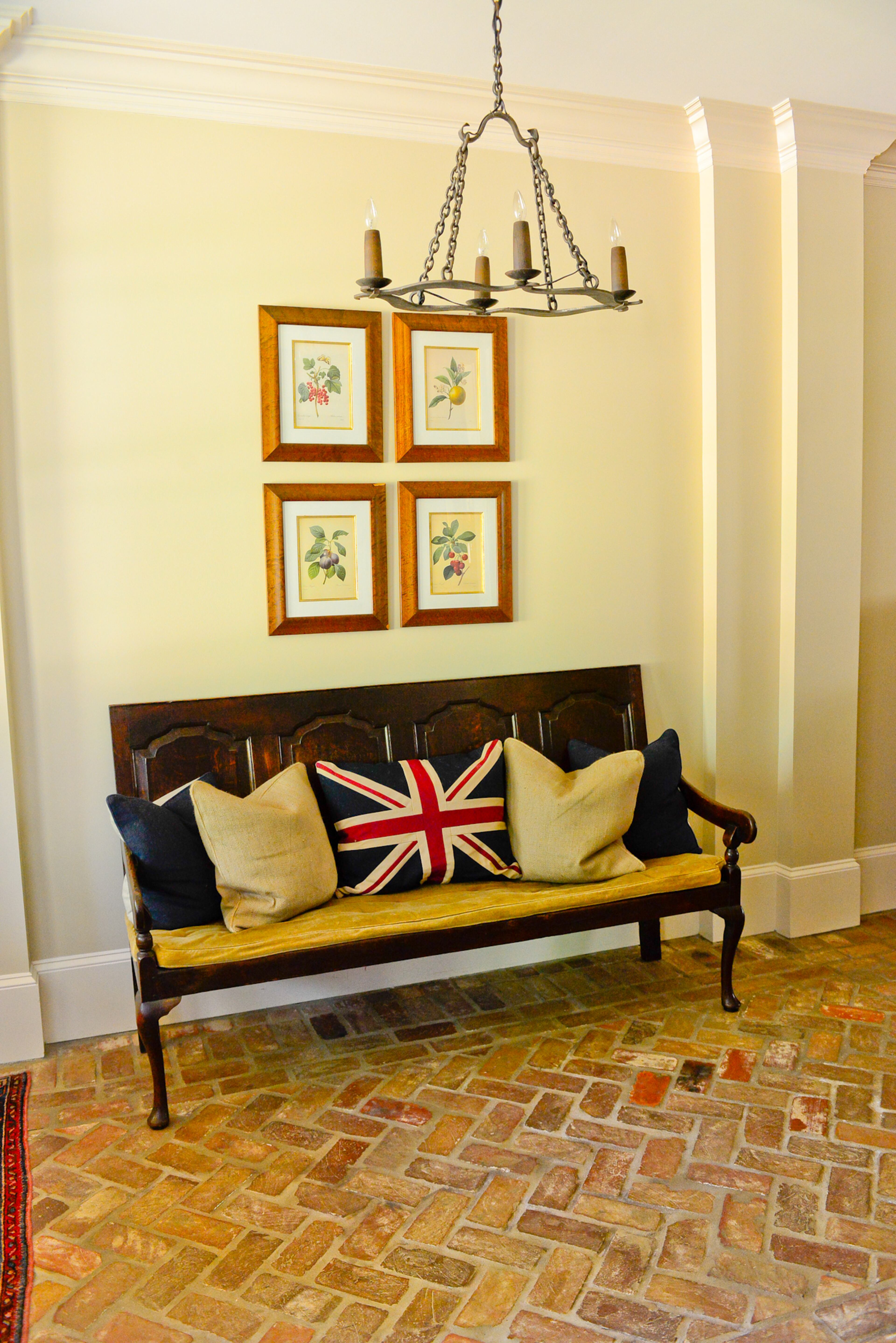 An old bench purchased at Scott Antique Market and brick from an old warehouse in Charleston, S.C., dress up the entryway of the Smyrna home.
