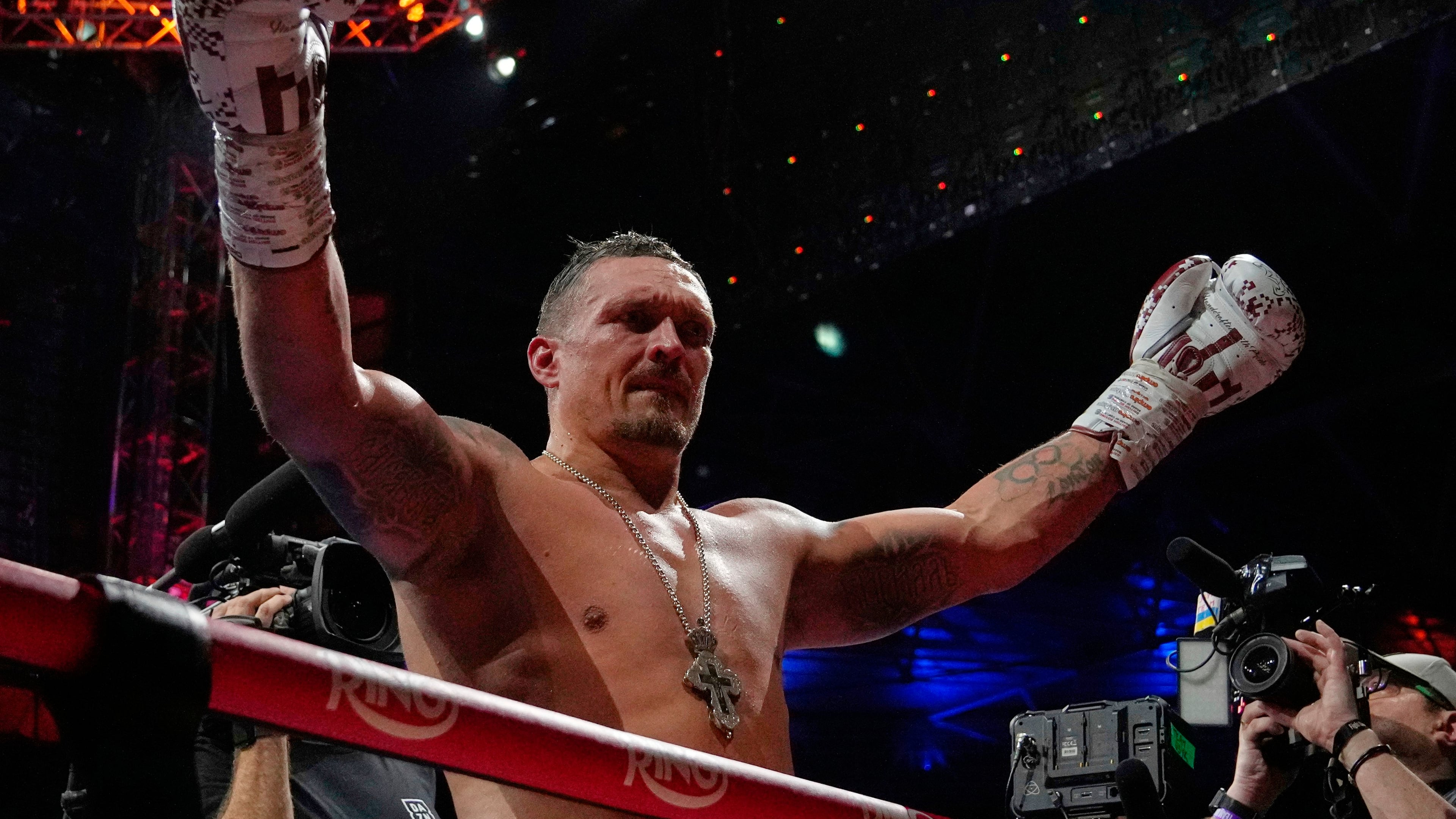FILE - Ukraine's Oleksandr Usyk celebrates winning the undisputed world heavyweight boxing title fight against Britain's Daniel Dubois in London, July 19, 2025. (AP Photo/Frank Augstein, File)