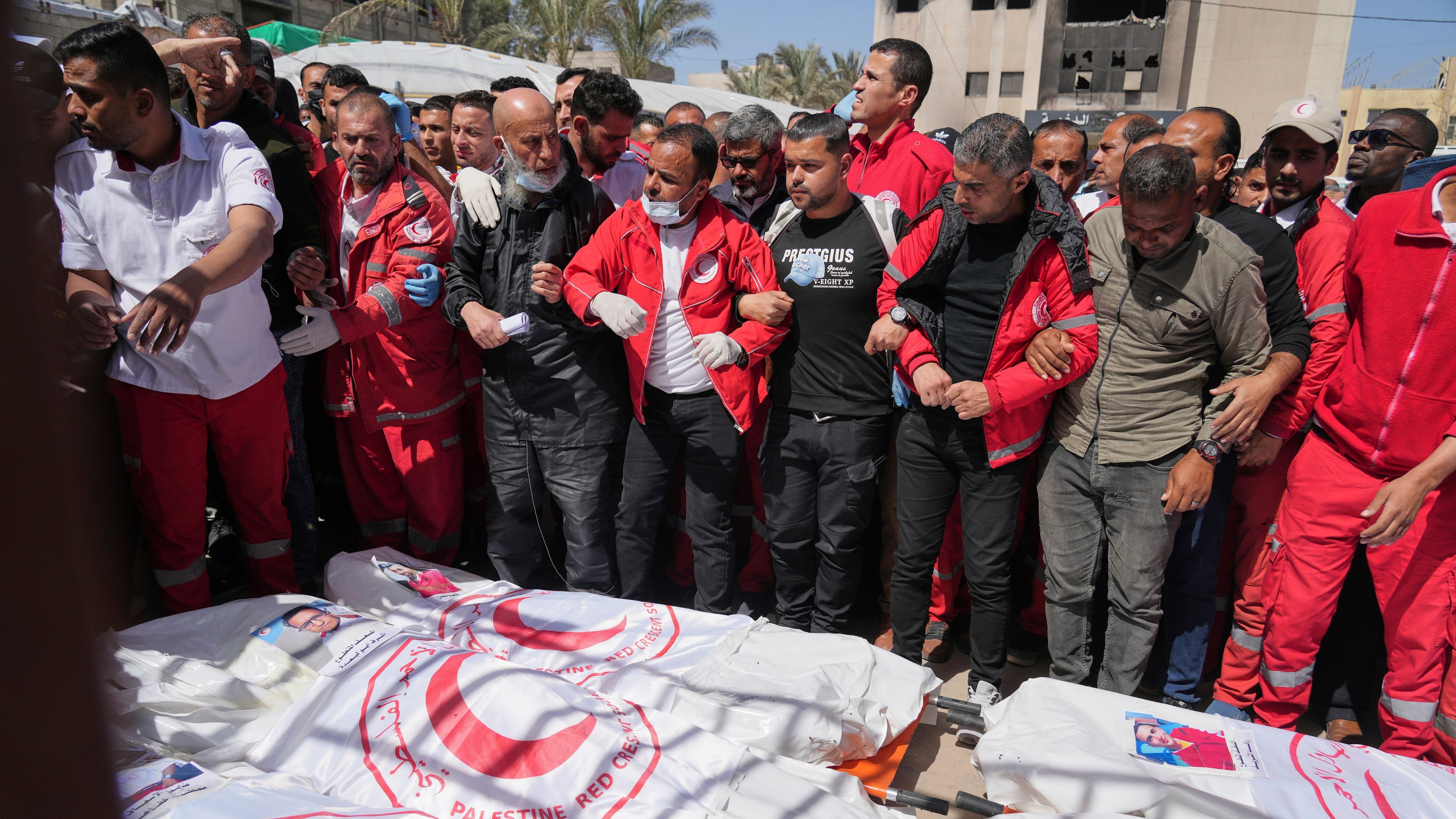FILE.- Mourners gather around the bodies of 8 Red Crescent emergency responders, recovered in Rafah a week after an Israeli attack, as they are transported for burial from a hospital in Deir al-Balah, Gaza Strip, on Monday, March 31, 2025. (AP Photo/Abdel Kareem Hana,File)