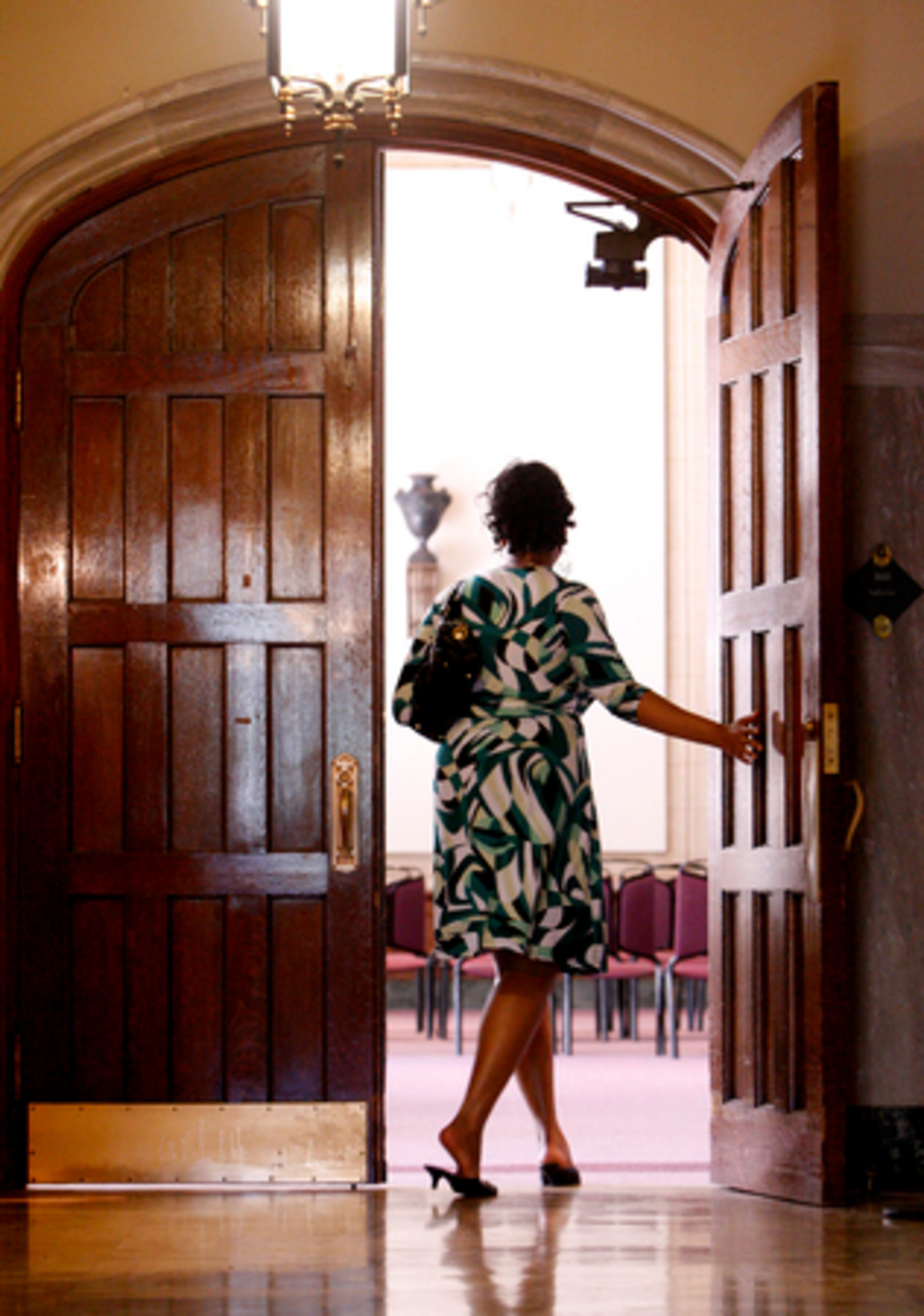 Dana Jenkins leaves Thursday's hearing. Union leaders, already upset about the job cuts, said they are angry that city officials plan to have police officers at the termination meetings.