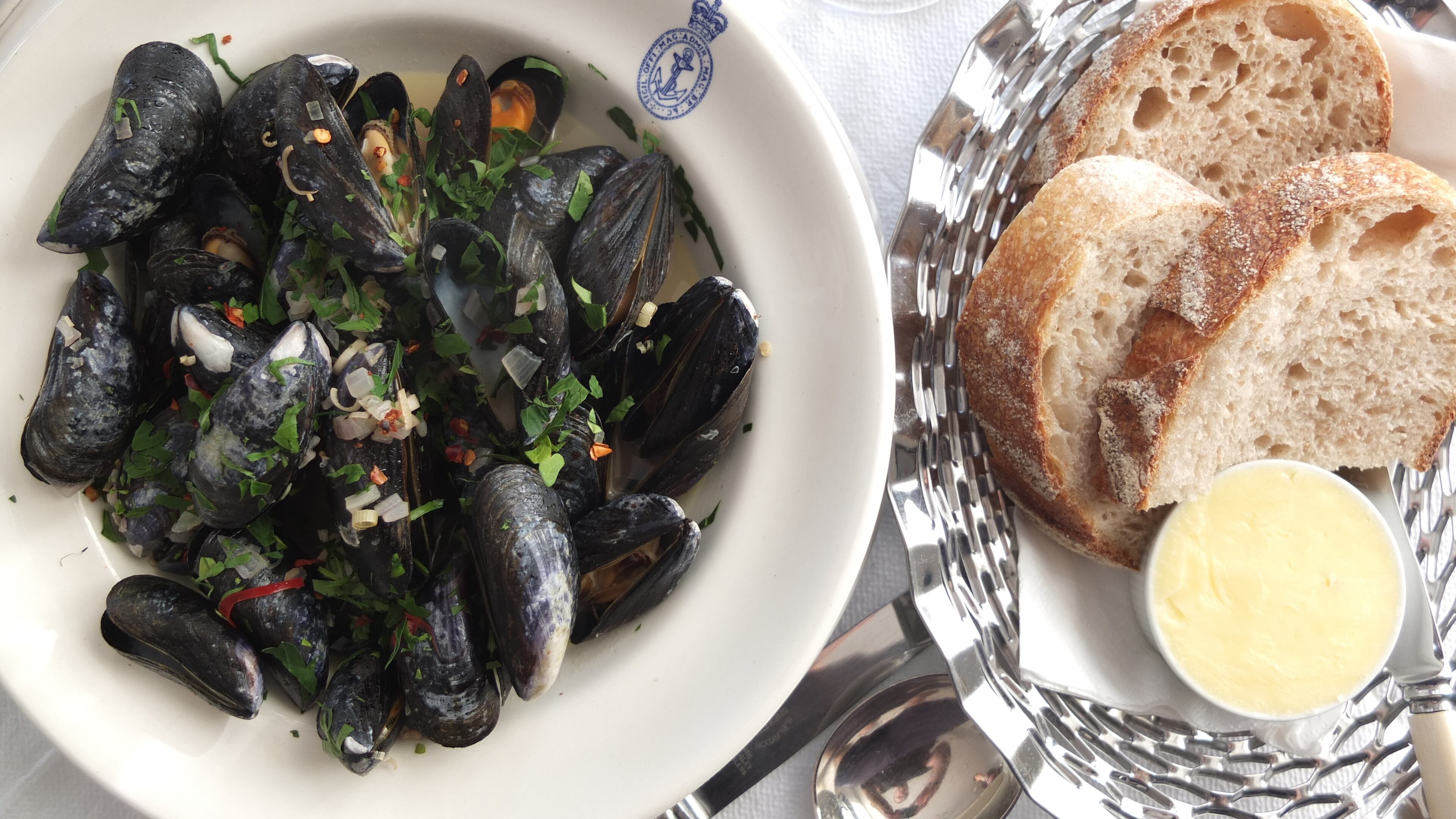 In an undated handout photo, mussels with chili and lemongrass at the Seaside Boarding House Restaurant and Bar in Dorset, England. The hotel and restaurant may be ensconced in rural England, but its menu and sensibilities are pure well-heeled London — with a touch of beach culture: white and blue-gray walls, minimalist furniture and crisp white tablecloths.