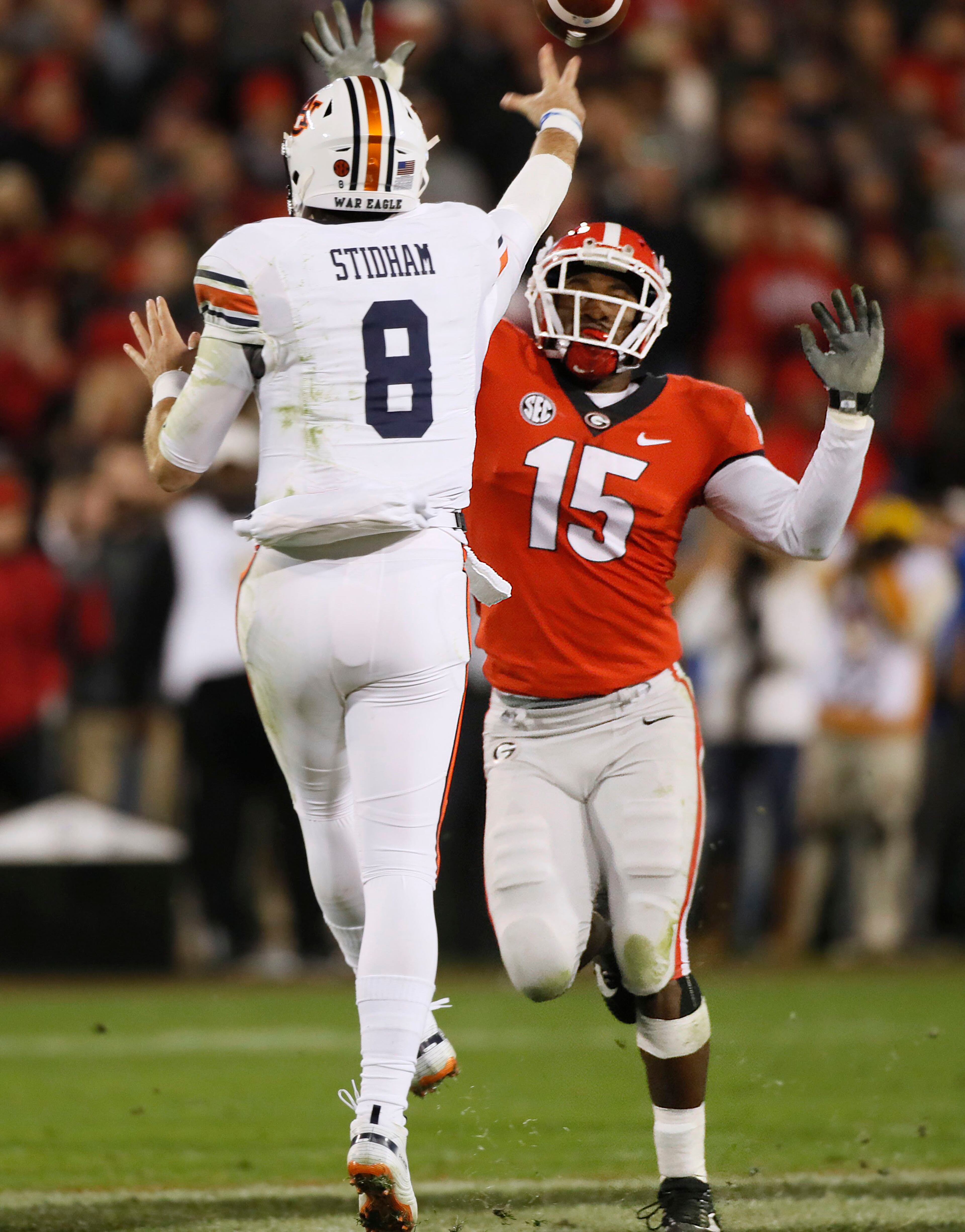 11/10/18 - Athens - Georgia Bulldogs linebacker D'Andre Walker (15) pressures Auburn Tigers quarterback Jarrett Stidham (8), who threw incomplete. The University of Georgia Bulldogs defeated the Auburn Tigers 27 - 10 in a NCAA college football game Saturday, Nov. 11th, 2018, at Sanford Stadium in Athens, GA. BOB ANDRES / BANDRES@AJC.COM