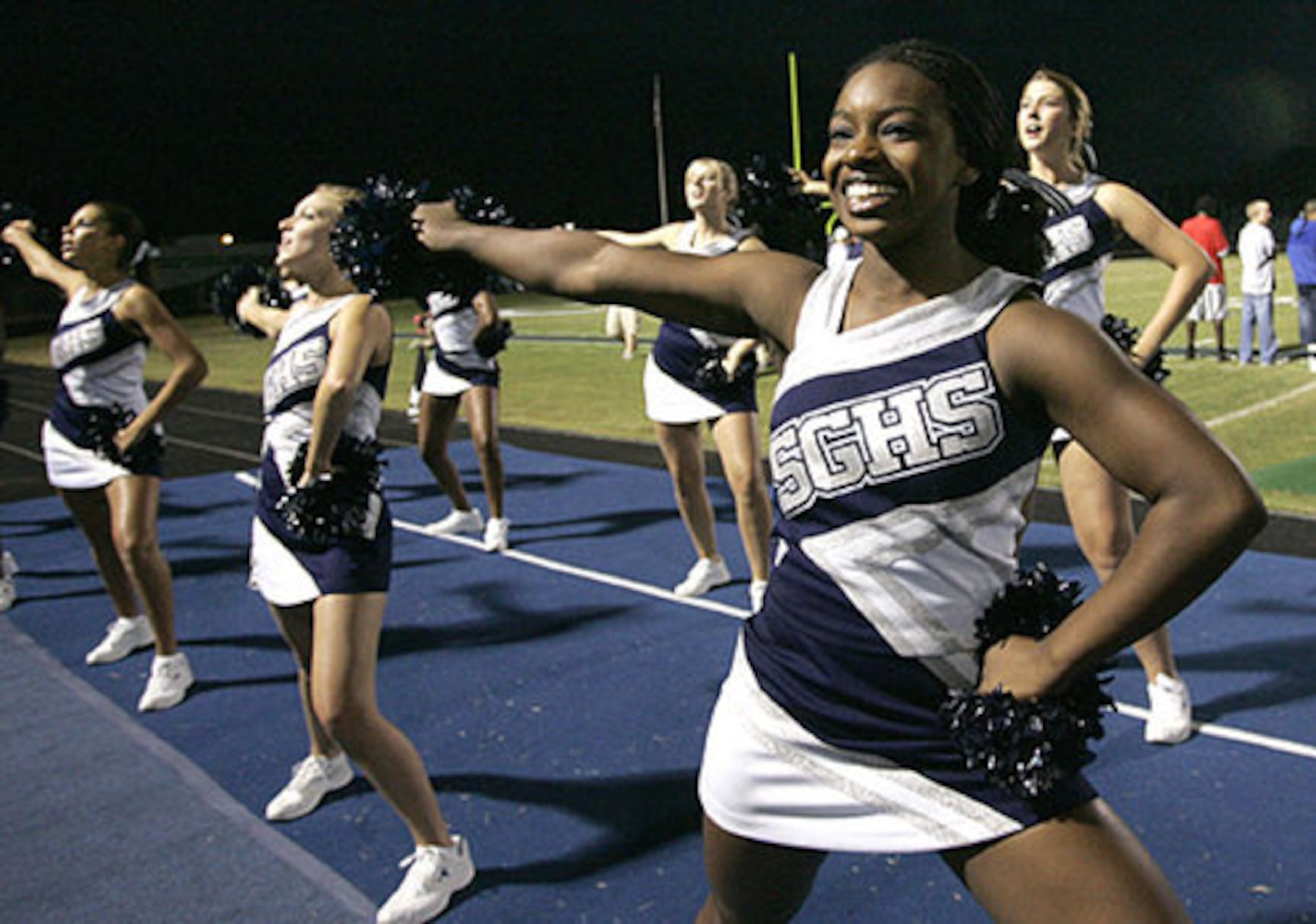 South Gwinnett varsity cheerleader Alexis Wooden tries to get fans pumped up.