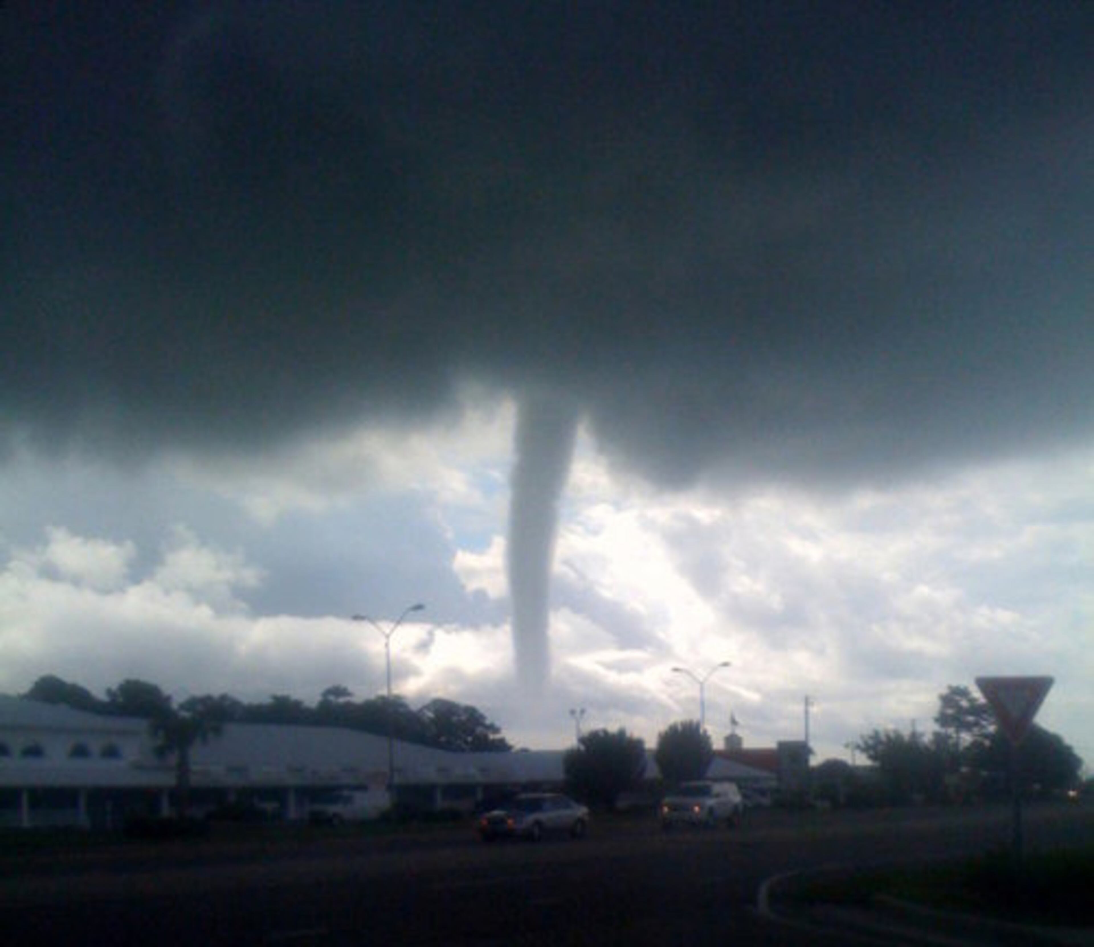 TORNADO WARNING--A funnel cloud is shown in this Aug. 18, 2011 photo made in Wilmington, N.C. The National Weather Service issued a tornado warning for southern New Hanover County until 11 a.m. The Weather Service also confirmed that there are numerous water spouts off the coast of southeastern North Carolina. The Carolina Beach Police Department has reported that two water spouts came in and touched the ground in the Alabama Avenue vicinity.