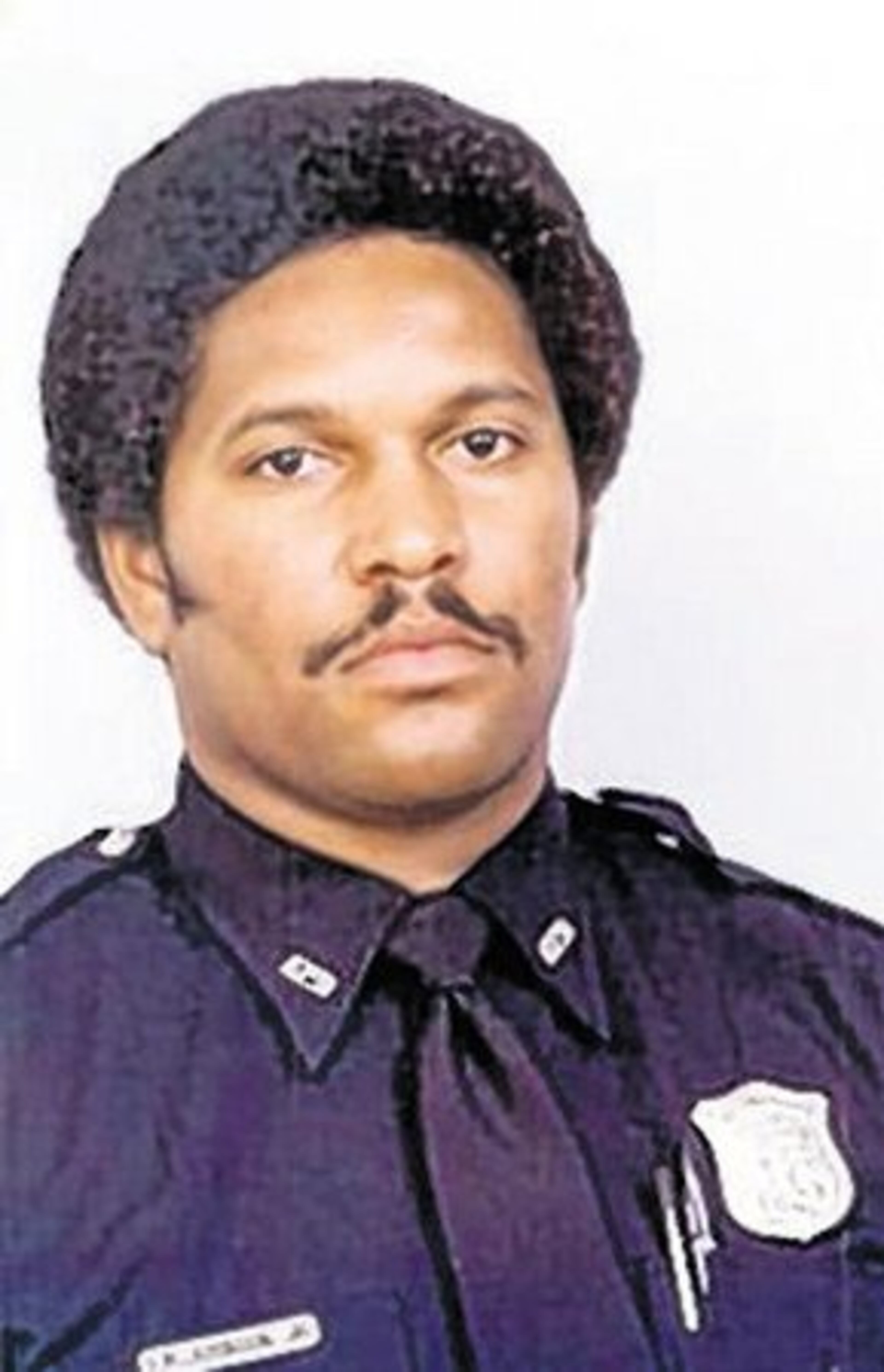 Atlanta Police Officer Alfred M. Johnson was moonlighting as a guard at an East Atlanta convenience store when two masked men burst in to rob the store. Johnson's murderers have never been found.T