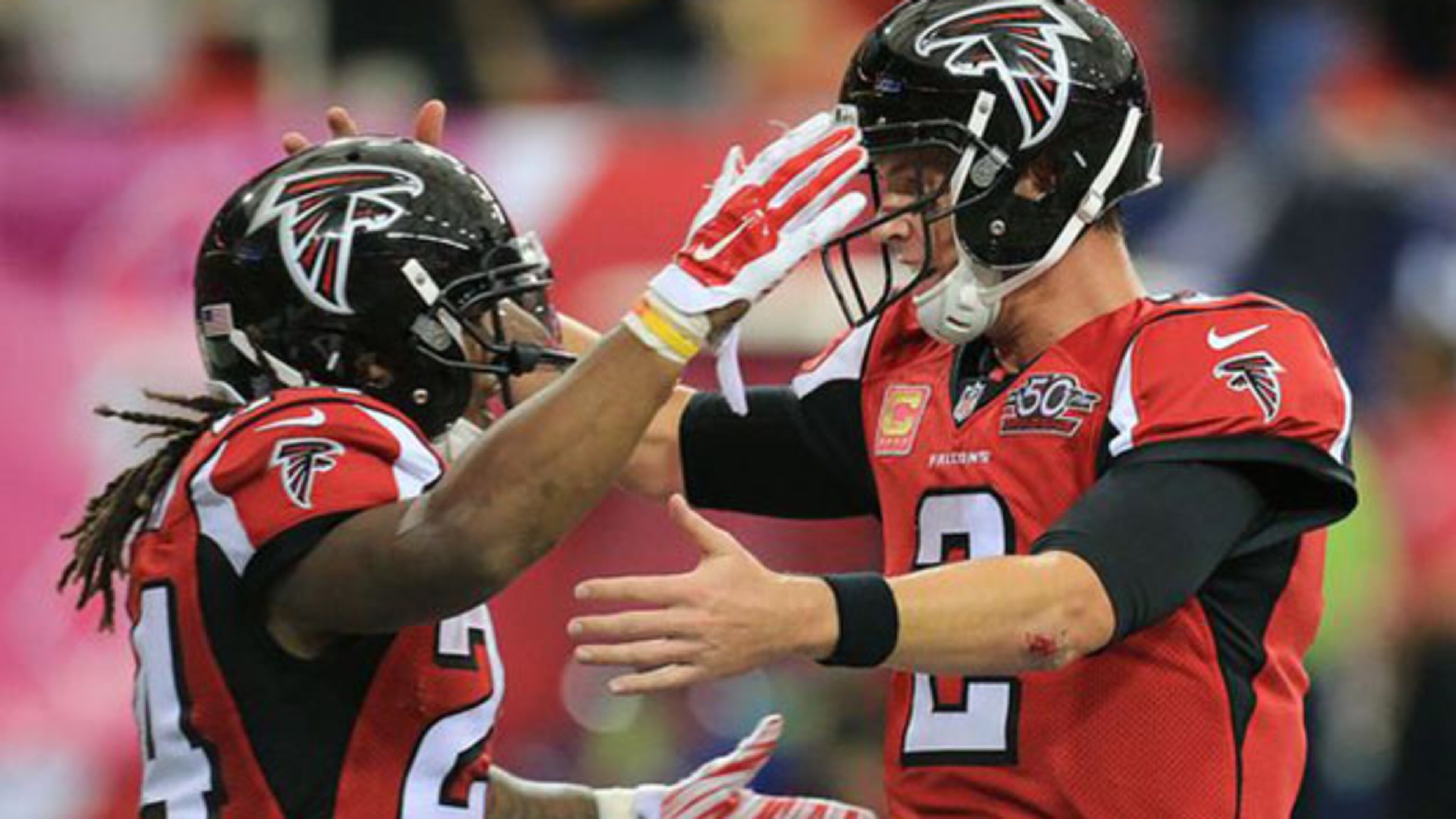 Falcons running back Devonta Freeman celebrates his second touchdown run of the day with quarterback Matt Ryan for a 14-0 lead over the Texans during the second quarter in a football game on Sunday, Oct. 4, 2015, in Atlanta.