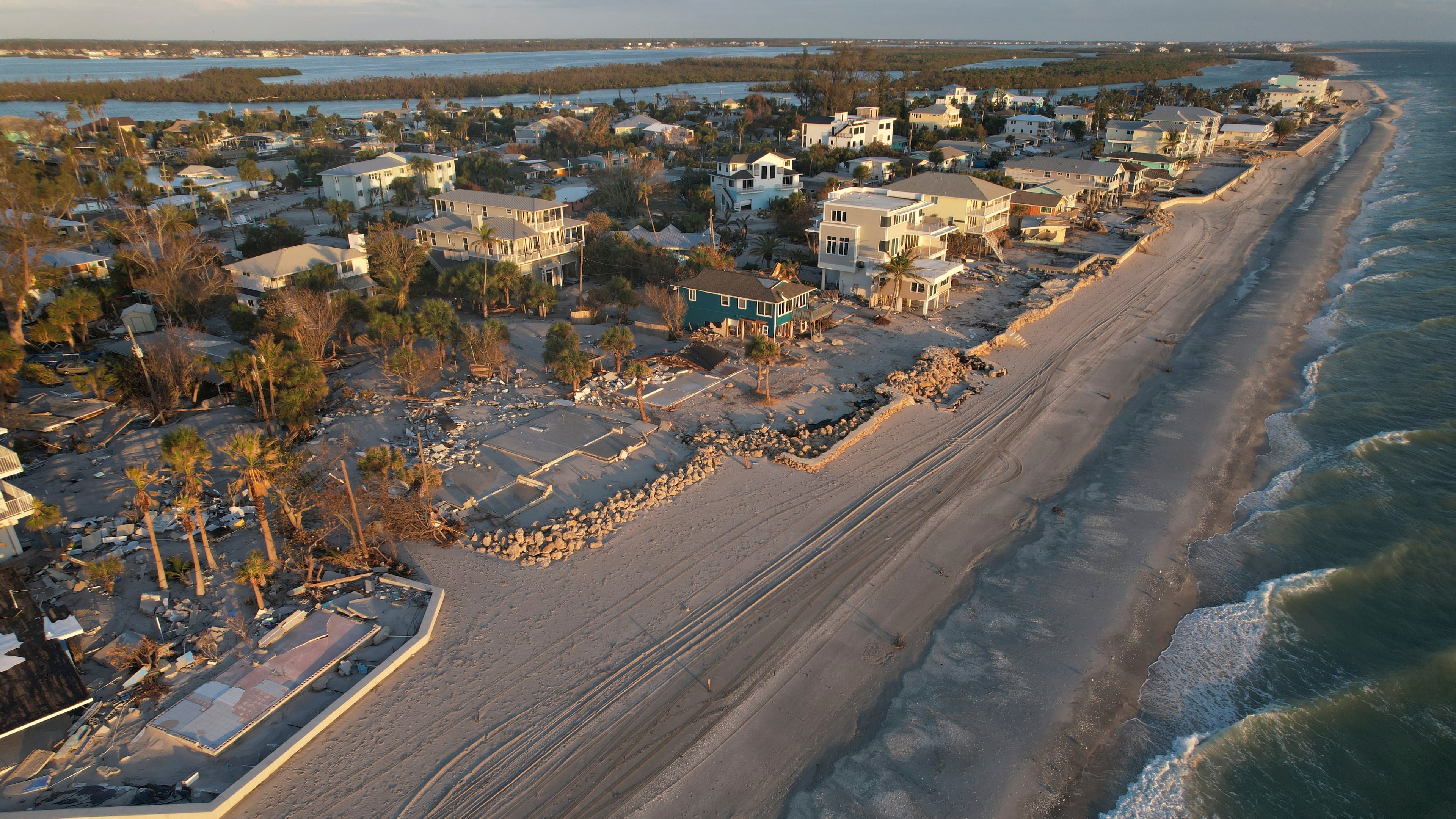 FILE - Waves roll in from the Gulf of Mexico toward lots where only empty foundations and debris remain after homes were swept away in Hurricane Milton on Manasota Key in Englewood, Fla., Oct. 13, 2024. (AP Photo/Rebecca Blackwell, File)