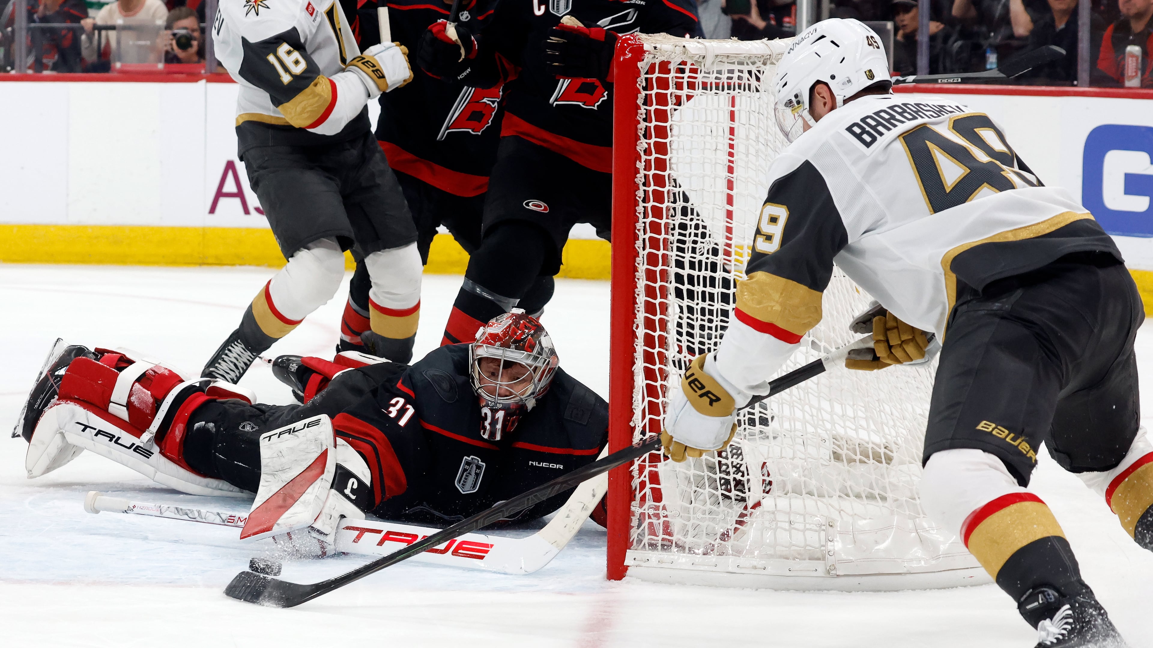 Carolina Hurricanes goaltender Frederik Andersen (31) stops a shot byf Vegas Golden Knights' Ivan Barbashev (49) during the third period in Game 2 of the NHL hockey Stanley Cup Final series in Raleigh, N.C., Thursday, June 4, 2026. (AP Photo/Karl DeBlaker)