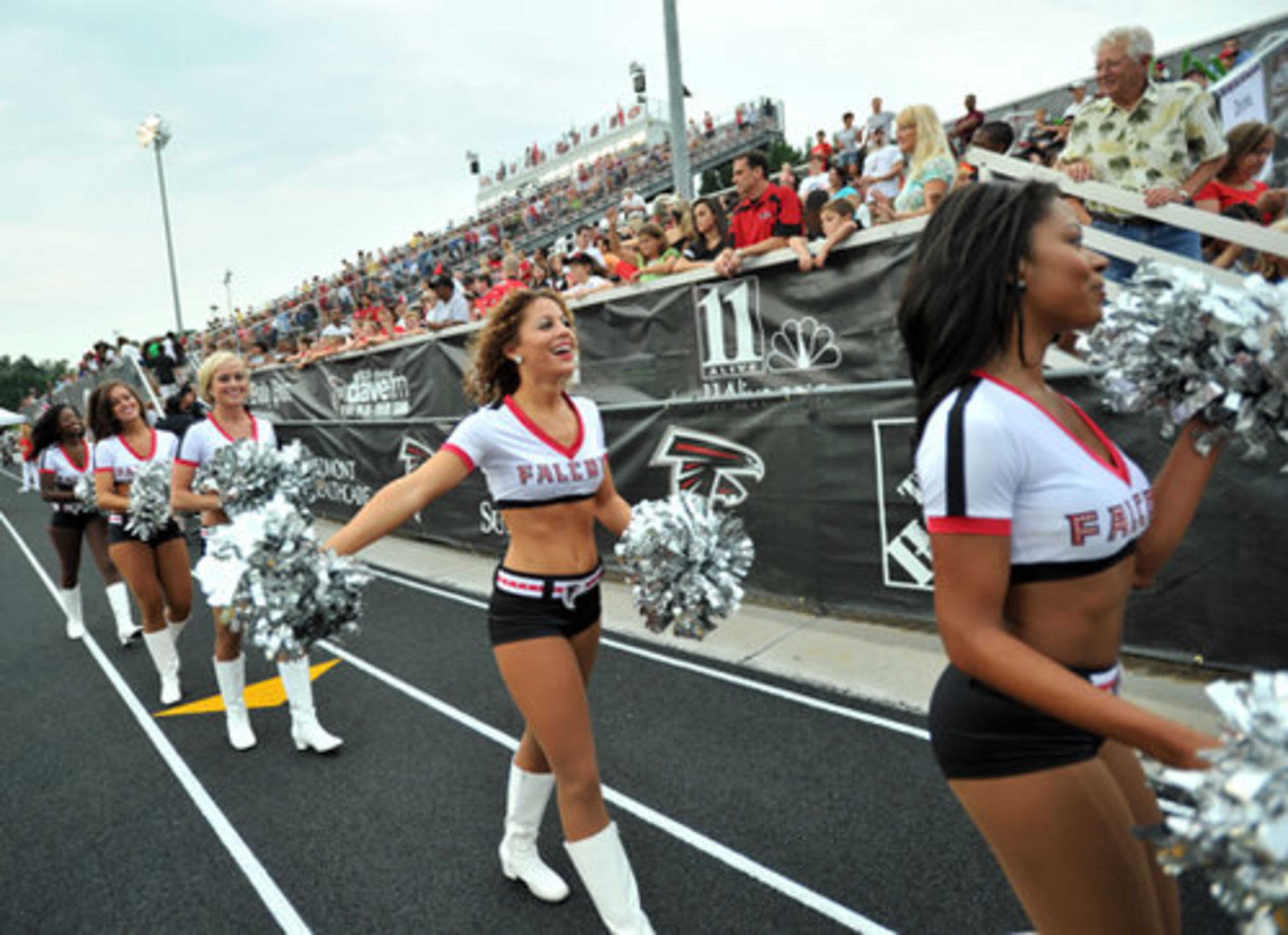 Falcons cheerleaders entertain fans during the Friday Night Lights. This free event includes a fan fest with interactive inflatable games, sponsor offers and giveaways, a post-event autograph session and a spectacular fireworks show. Friday, August 6, 2010.