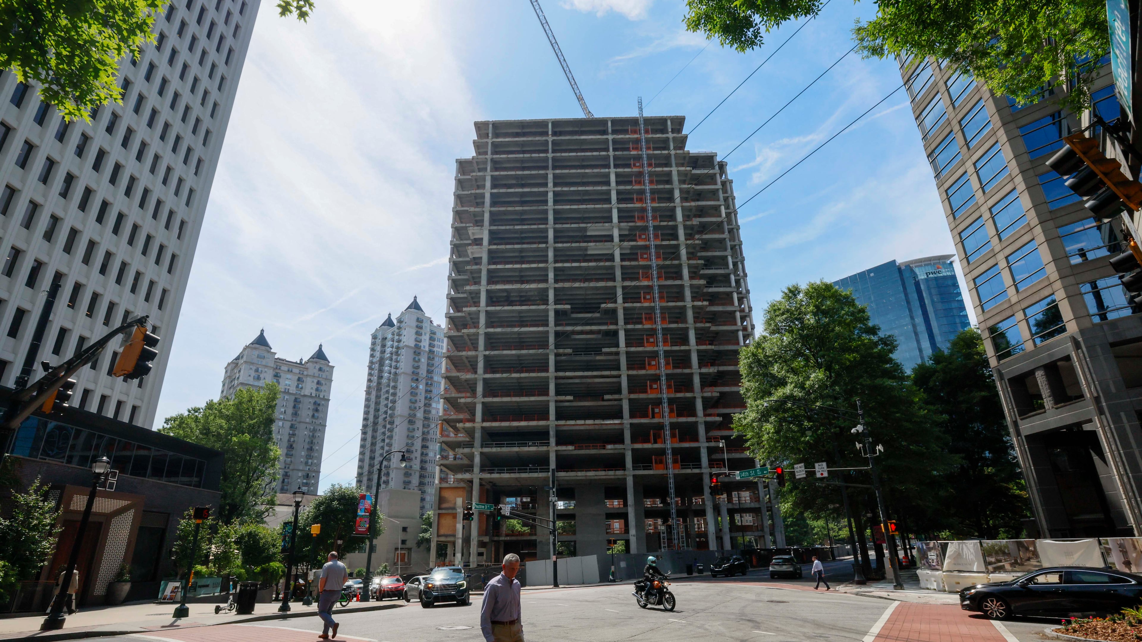The Campanile building is visible from Peachtree Street NE and 14th Street on Tuesday, May 19, 2026. The well-known Midtown construction site has remained incomplete for years. Local residents are unhappy with the slow progress, and some city officials have taken notice. (Miguel Martinez/AJC)