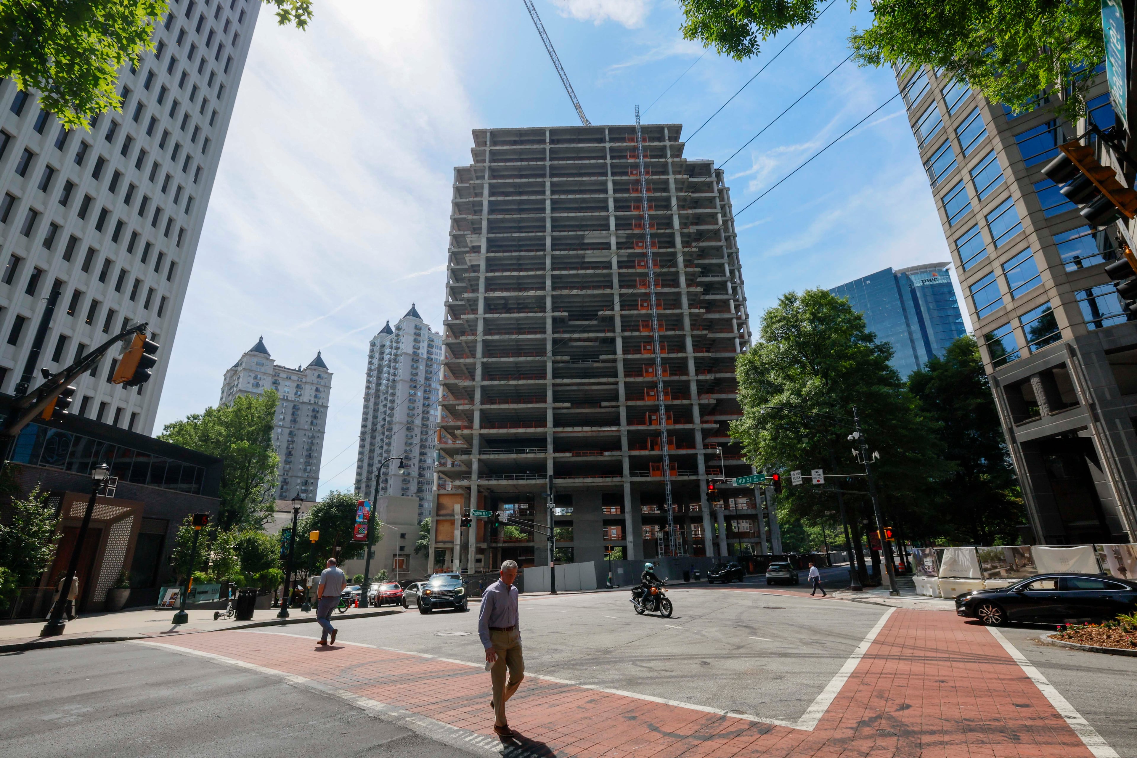 The Campanile building is visible from Peachtree Street NE and 14th Street on Tuesday, May 19, 2026. The well-known Midtown construction site has remained incomplete for years. Local residents are unhappy with the slow progress, and some city officials have taken notice. (Miguel Martinez/AJC)
