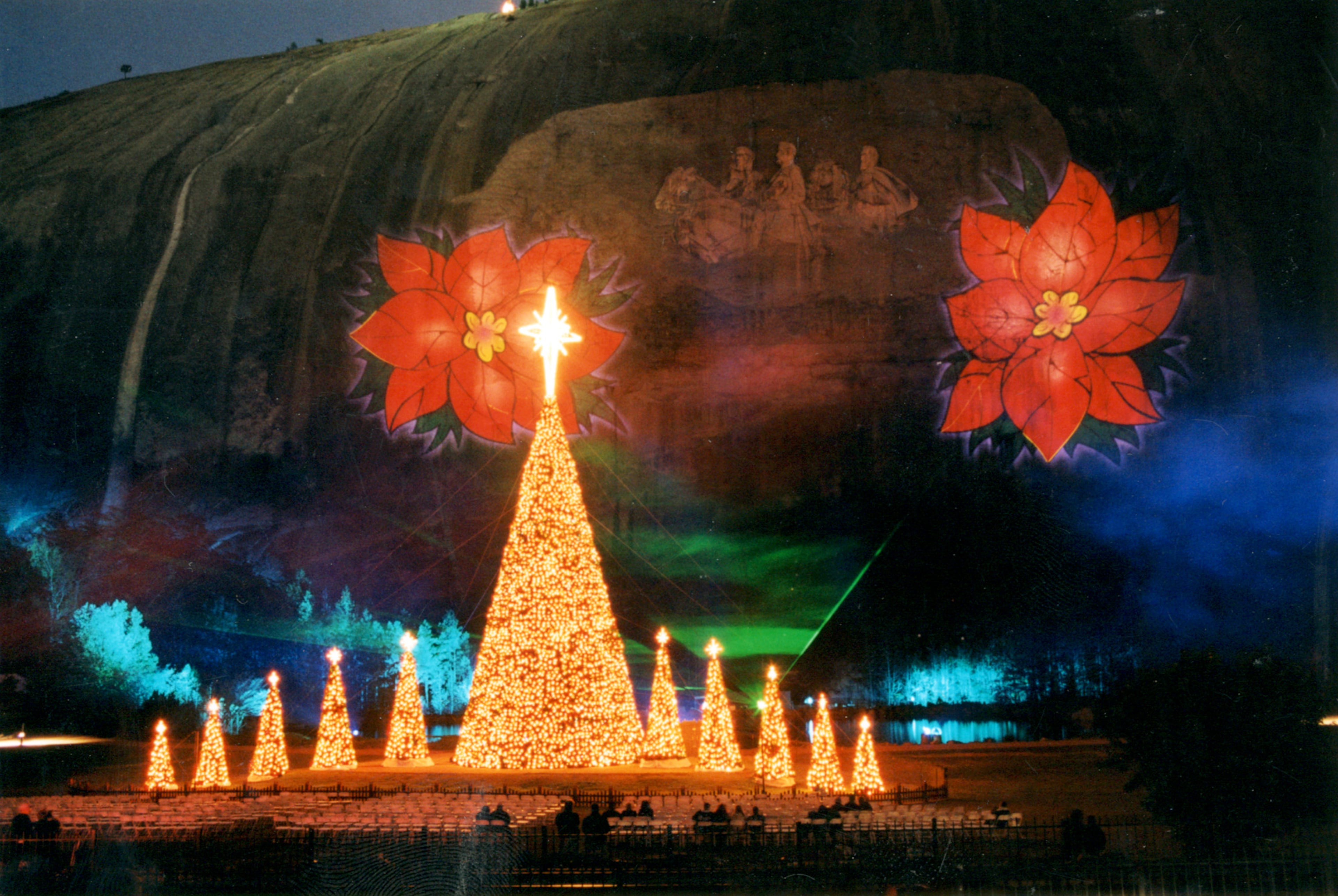 Georgia's Stone Mountain Christmas features a Christmas tree and a laser light show during the holidays. Stone Mountain Park's laser show is projected on the Confederate Memorial Carving. Buildings in the Crossroads attraction at Stone Mountain Park are decorated with Christmas lights.