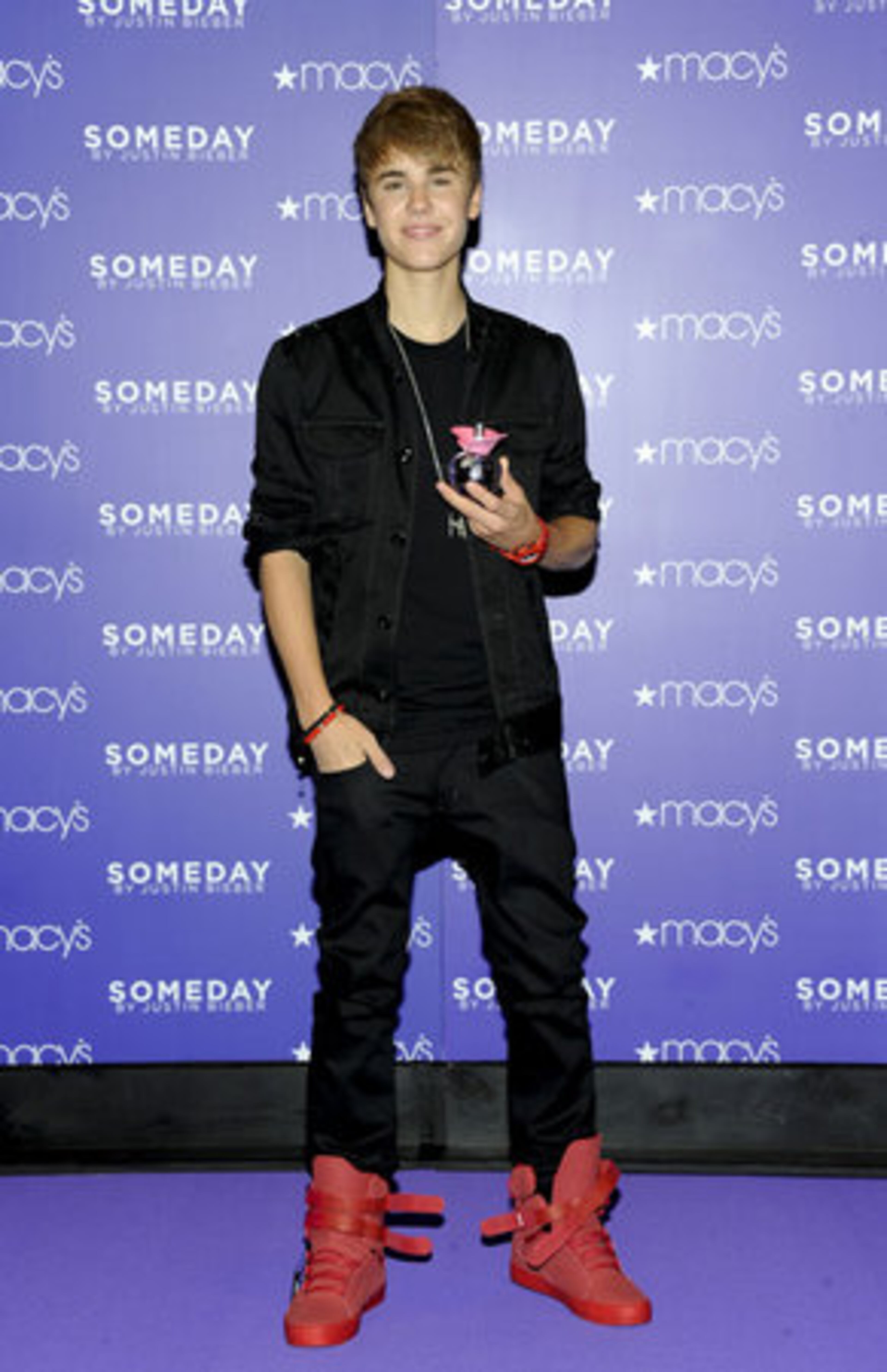 The teenage pop star wore all black, accented with red high-top sneakers.