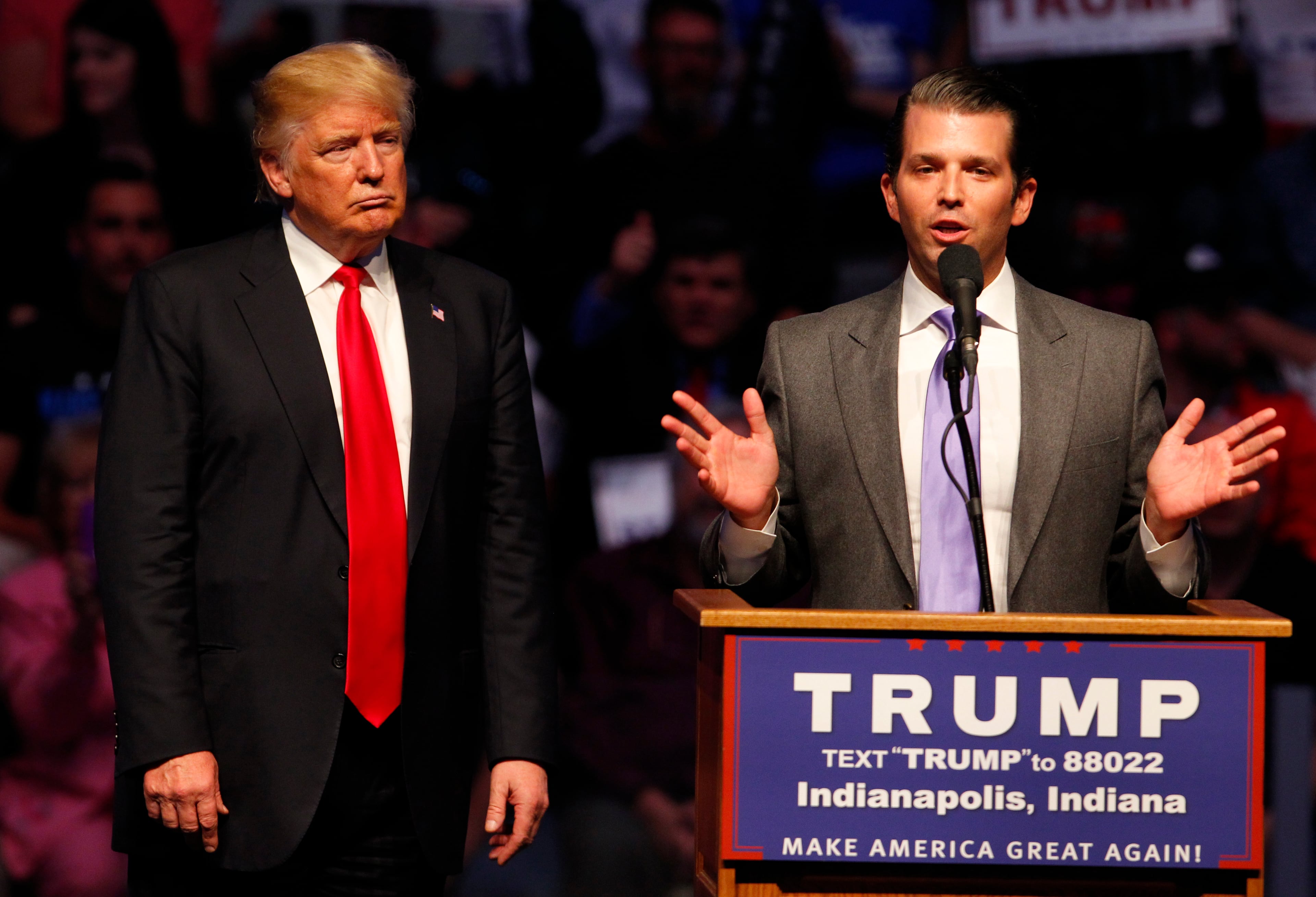 Donald Trump Jr. (R) talks about why his dad Republican presidential candidate Donald Trump (L) as he addressing the crowd during a campaign rally at the Indiana Farmers Coliseum on April 27, 2016 in Indianapolis, Indiana. Trump was preparing for the Indiana Primary on May 3rd. (Photo by John Sommers II/Getty Images)