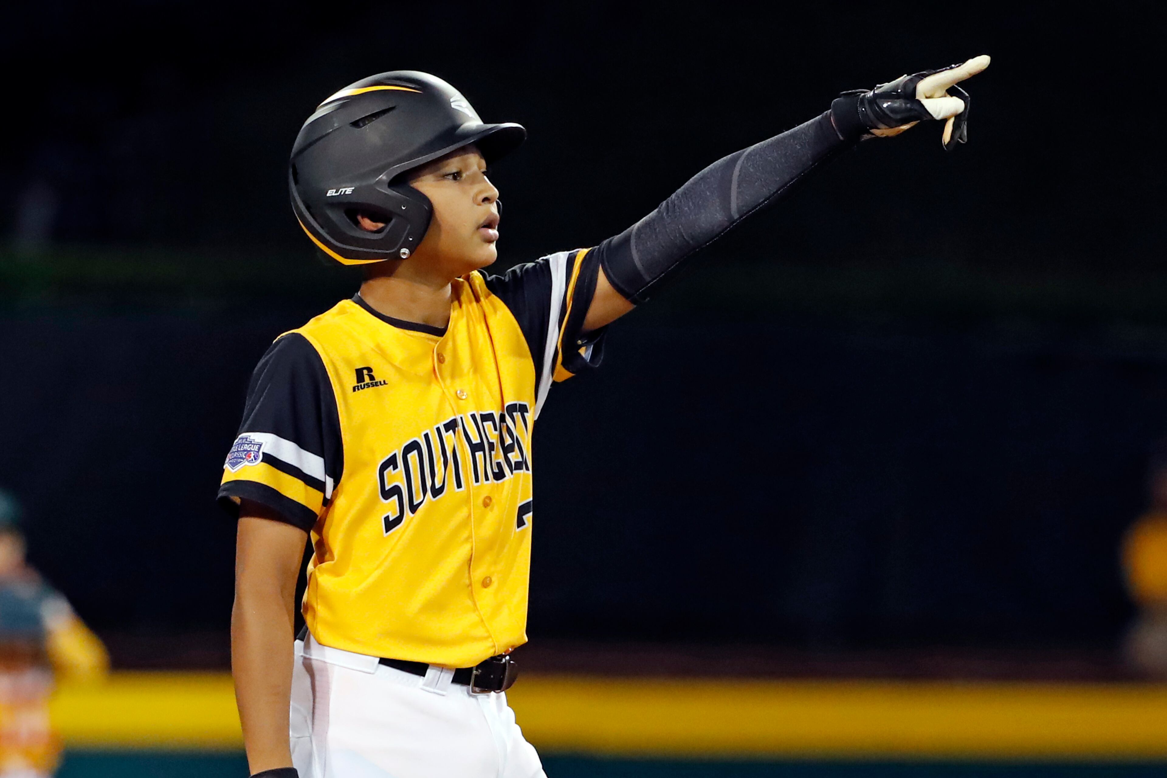 Peachtree City, Georgia's Tai Peete (7) celebrates as he stands on second base after driving in a run with a double off Houston, Texas' Ethan Goldstein in the sixth inning of an elimination baseball game in United States pool play at the Little League World Series tournament in South Williamsport, Pa., Monday, Aug. 20, 2018. Georgia won 7-6 in nine innings, eliminating Texas. (AP Photo/Gene J. Puskar)