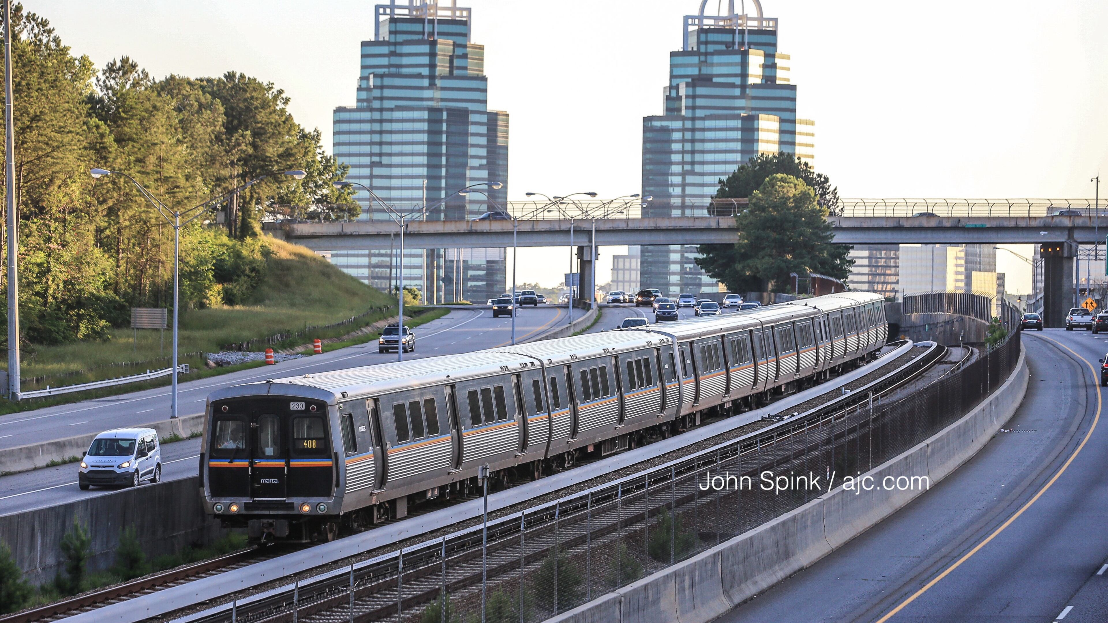 A MARTA train heads southbound from the Medical Center station on the red line Monday morning, hours after a crash involving a train and a contractor shut down the line overnight. JOHN SPINK / JSPINK@AJC.COM