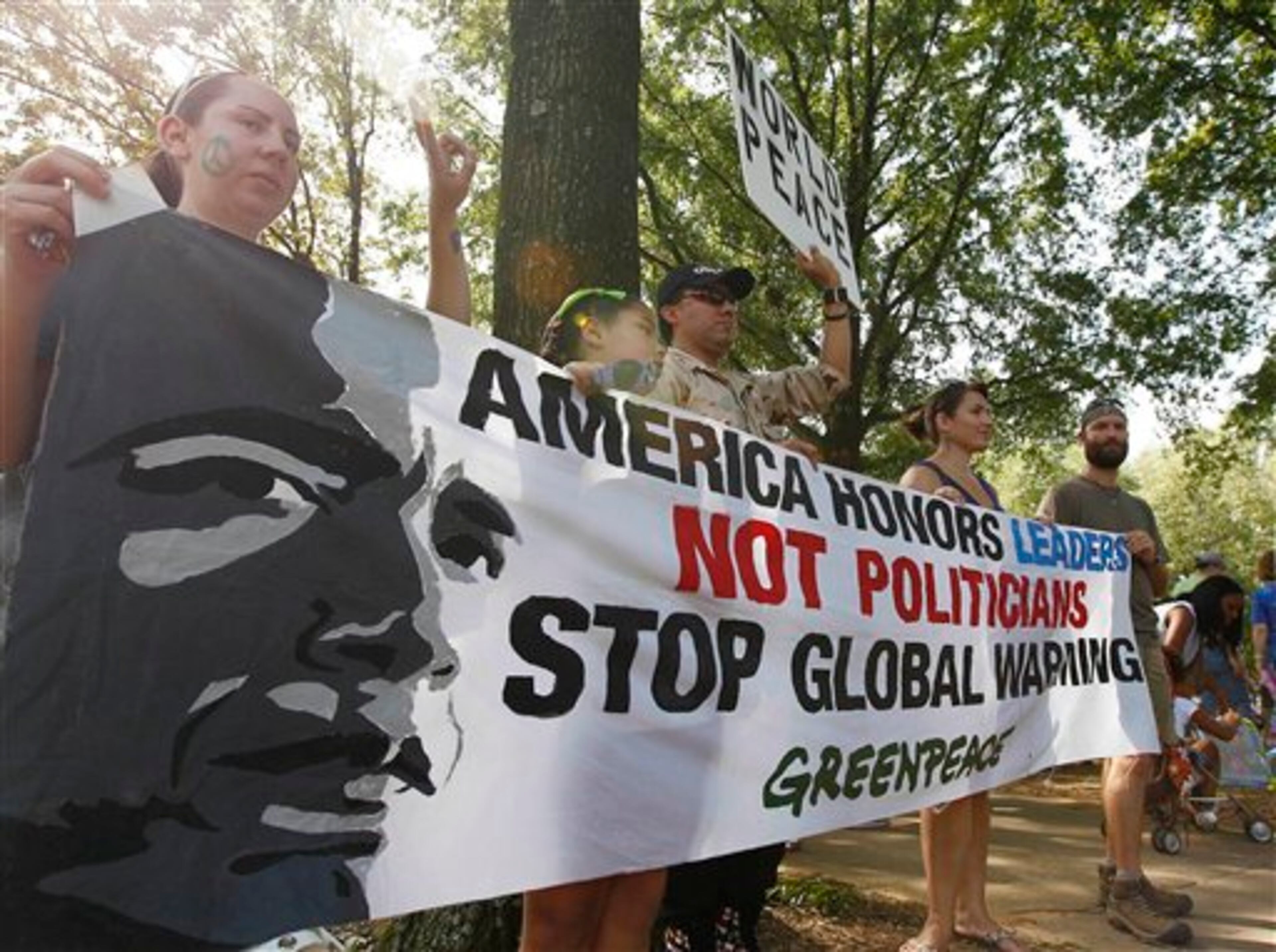 Demonstrators march in a Labor Day parade, Monday, Sept. 3, 2012, in Charlotte, N.C. Demonstrators are protesting before the start of the Democratic National Convention. (AP Photo/Gerry Broome)