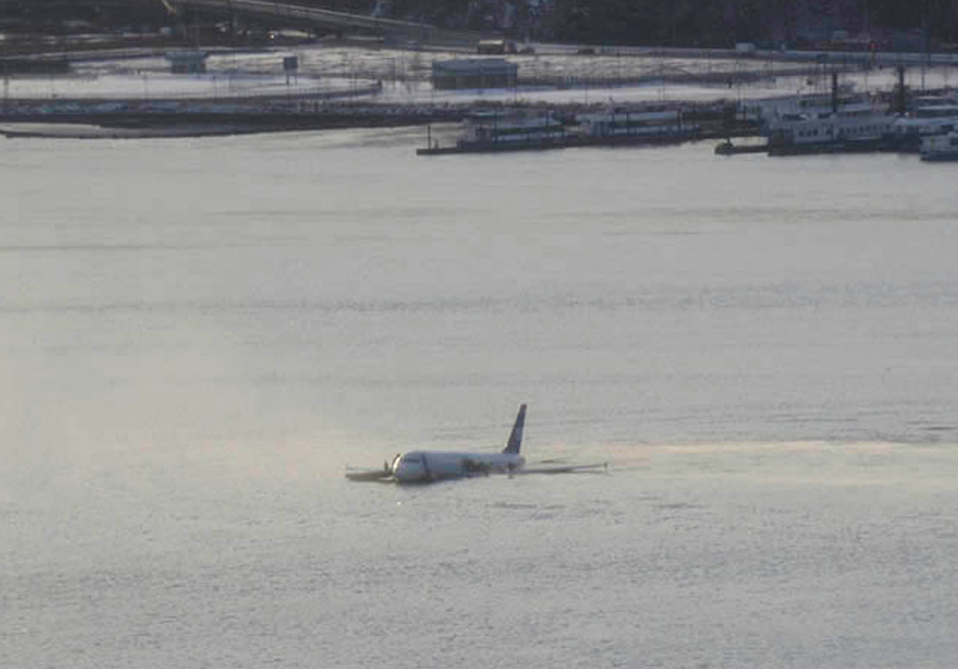 A US Airways jetliner is seen after it crashed into the Hudson River Thursday afternoon, Jan. 15, 2009 after a flock of birds apparently disabled both its engines. Rescuers pulled the more than 150 passengers and crew members into boats before the plane sank, authorities say. Federal Aviation Administration spokeswoman Laura Brown said Flight 1549 had just taken off from LaGuardia Airport en route to Charlotte, N.C., when the crash occurred in the river near 48th Street in midtown Manhattan. (AP Photo/Greg Lam Pak Ng)
