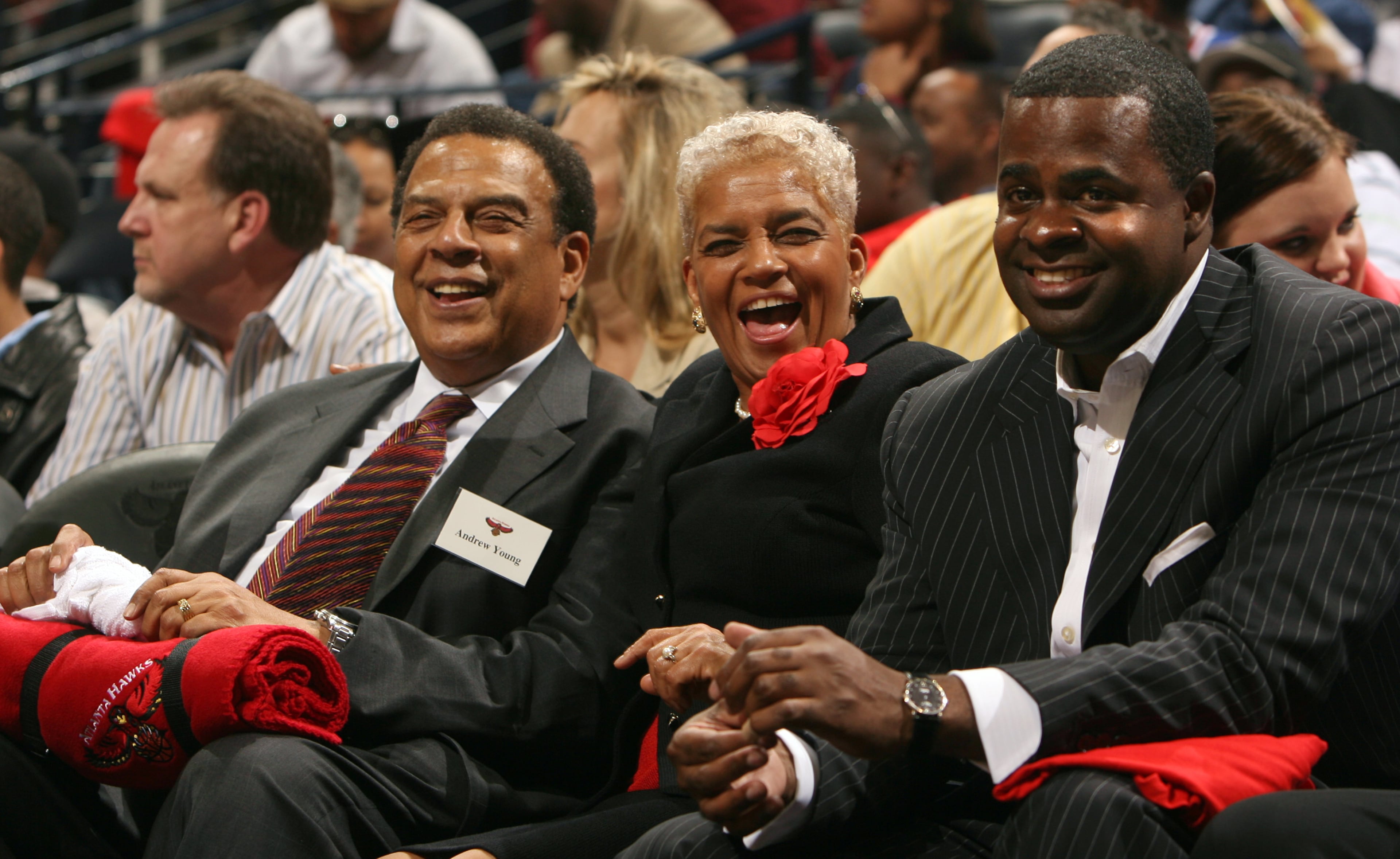 Atlanta's then-mayor Shirley Franklin, center, enjoys the Atlanta Hawks home opener against the LA Lakers on November 8, 2005, seated between former mayor Andrew Young and then-state-senator Kasim Reed. (Brant Sanderlin / AJC file photo)