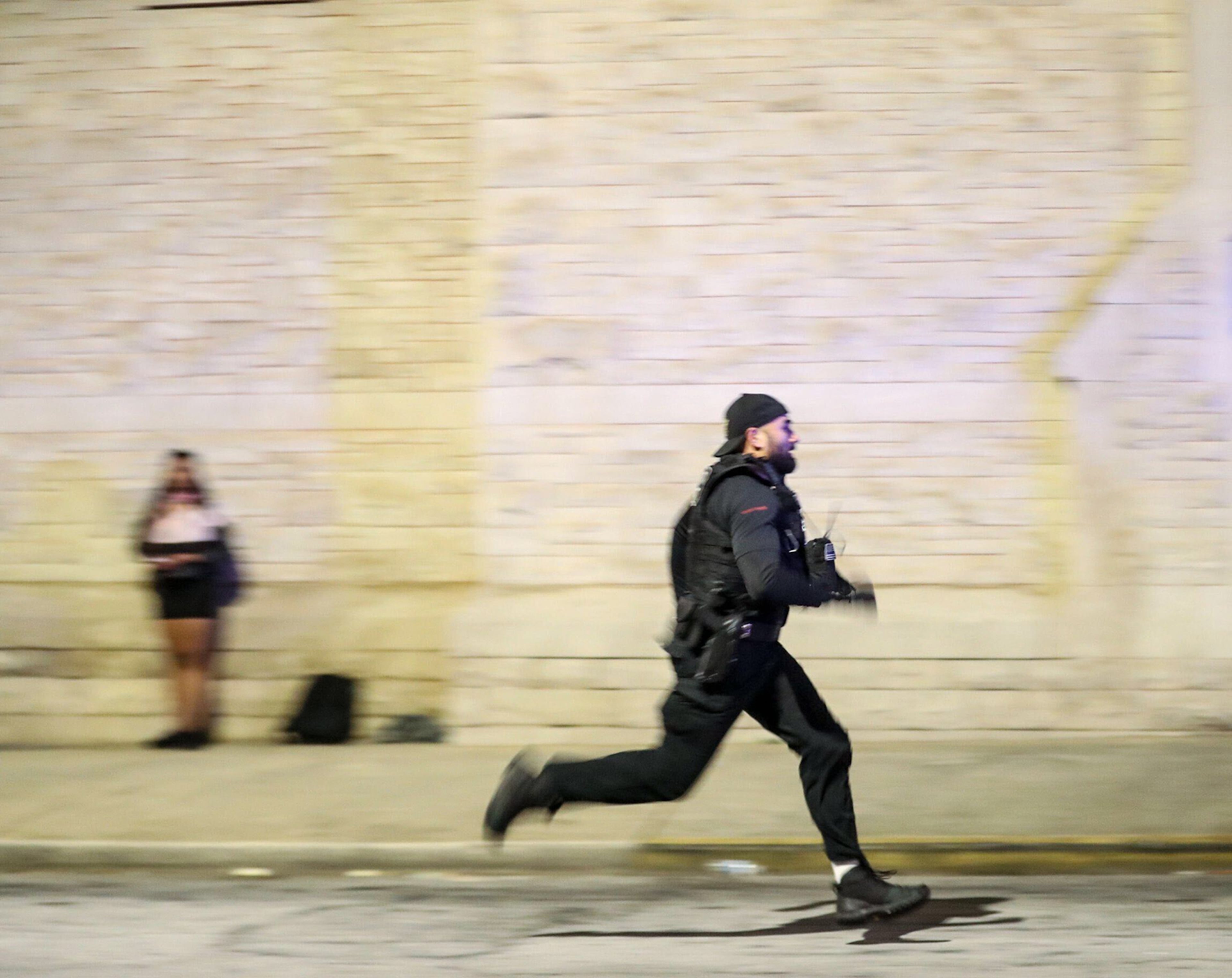 An APD Officer chases a demonstrator down Washington Street on Wednesday, Sept. 23, 2020, in downtown Atlanta. The demonstrator was apprehended and arrested. (Alyssa Pointer / Alyssa.Pointer@ajc.com)