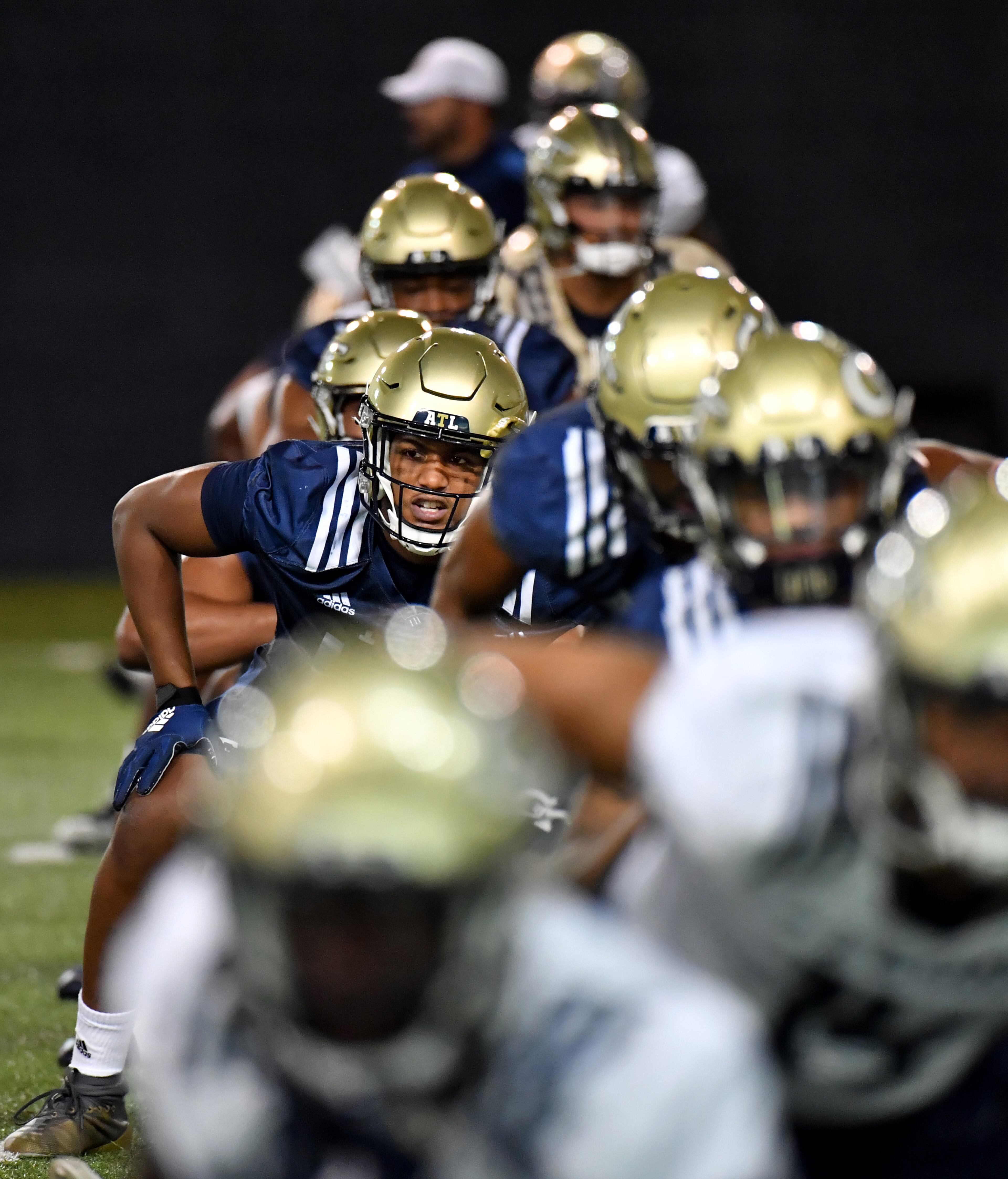 Georgia Tech players stretch during a football practice at Rose Bowl Field on Georgia Tech Campus in Atlanta on Friday, August 6, 2021. (Hyosub Shin / Hyosub.Shin@ajc.com)