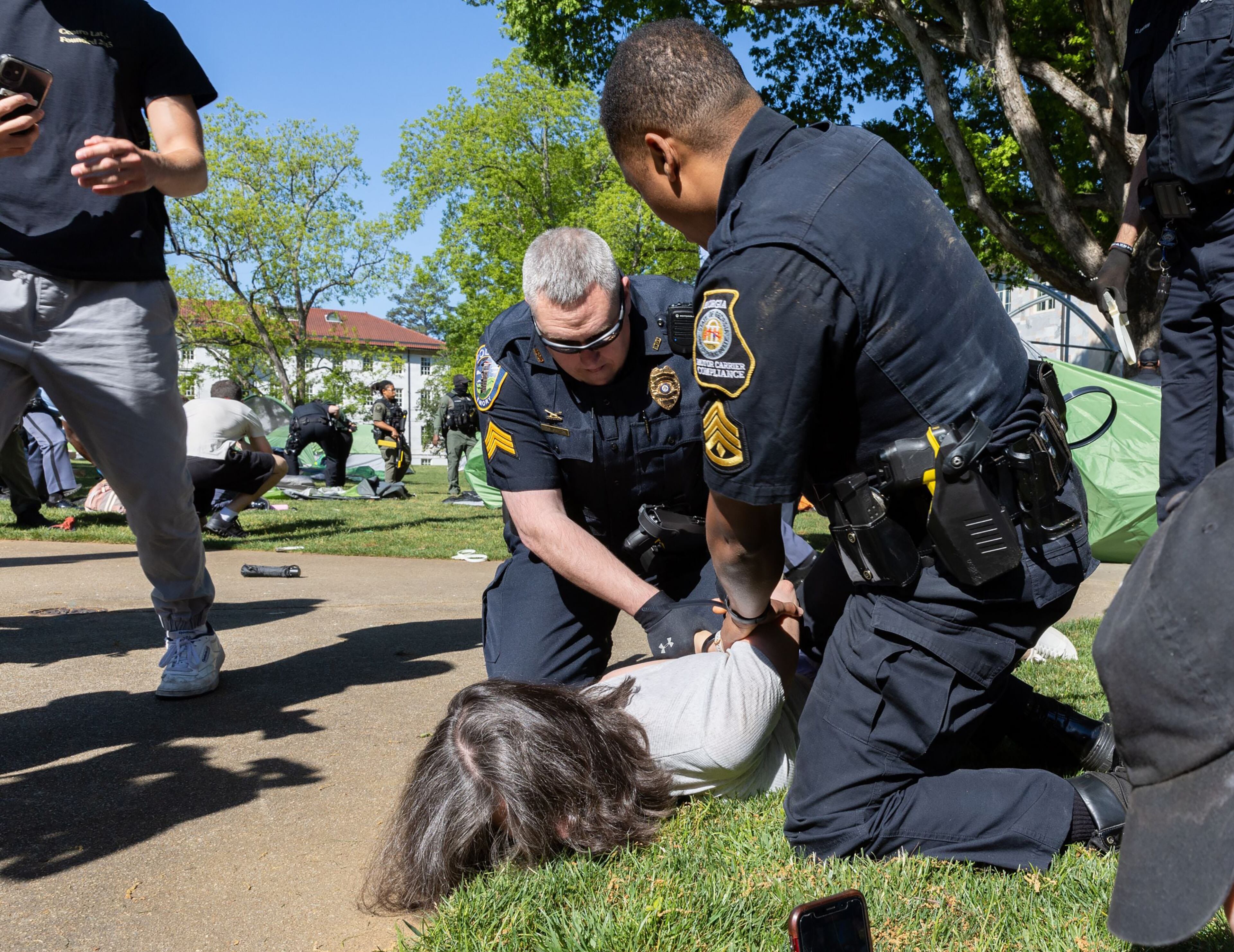 Police arrest pro-Palestinian protesters who set up an encampment at the Emory campus in Atlanta on Thursday, April 25, 2024. (Arvin Temkar/The Atlanta Journal-Constitution/TNS)