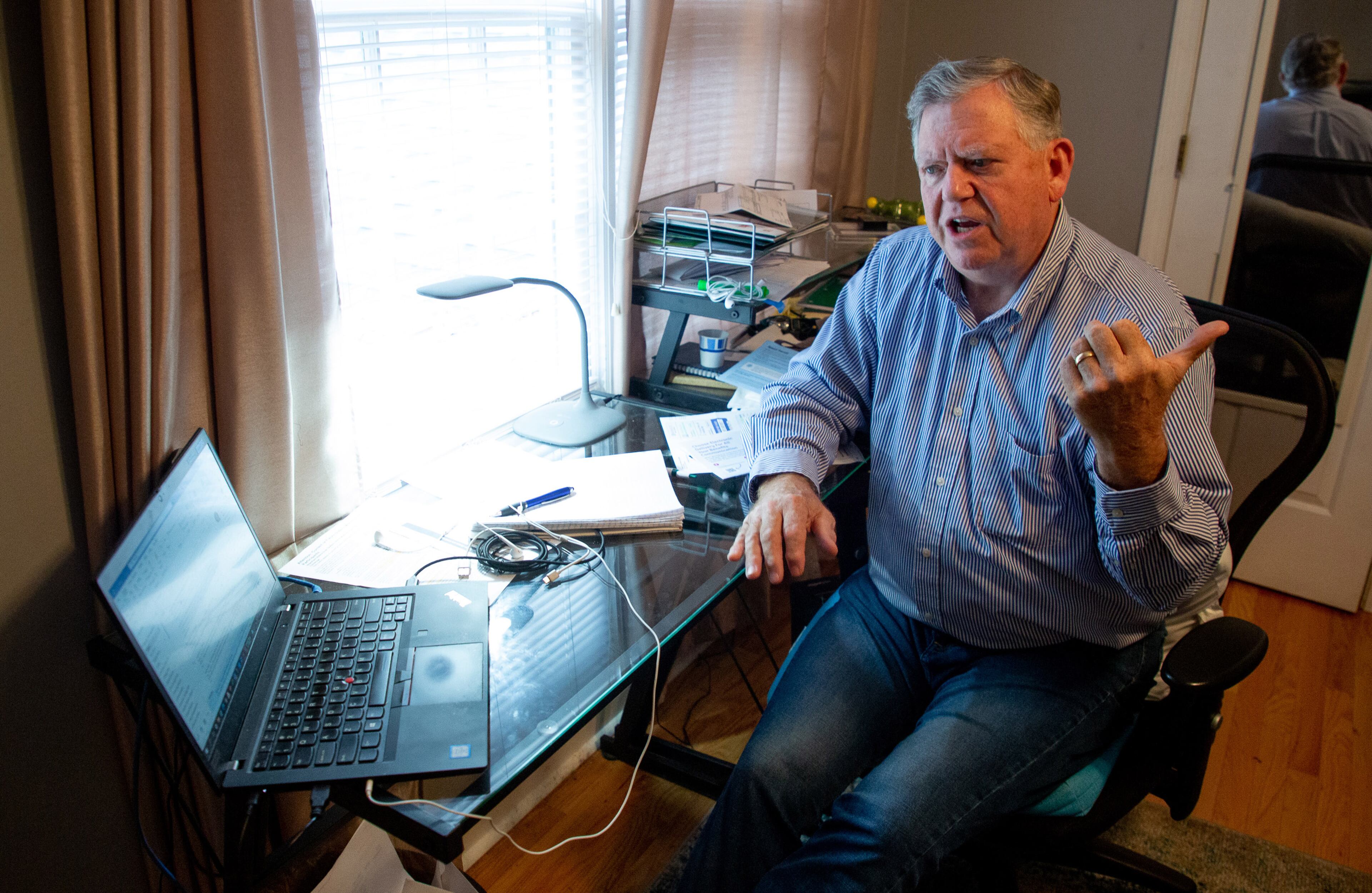 Randy Michael talks about his parent college student loan debt in his Alpharetta home office on Oct. 29, 2021. (Steve Schaefer for The Atlanta Journal-Constitution)