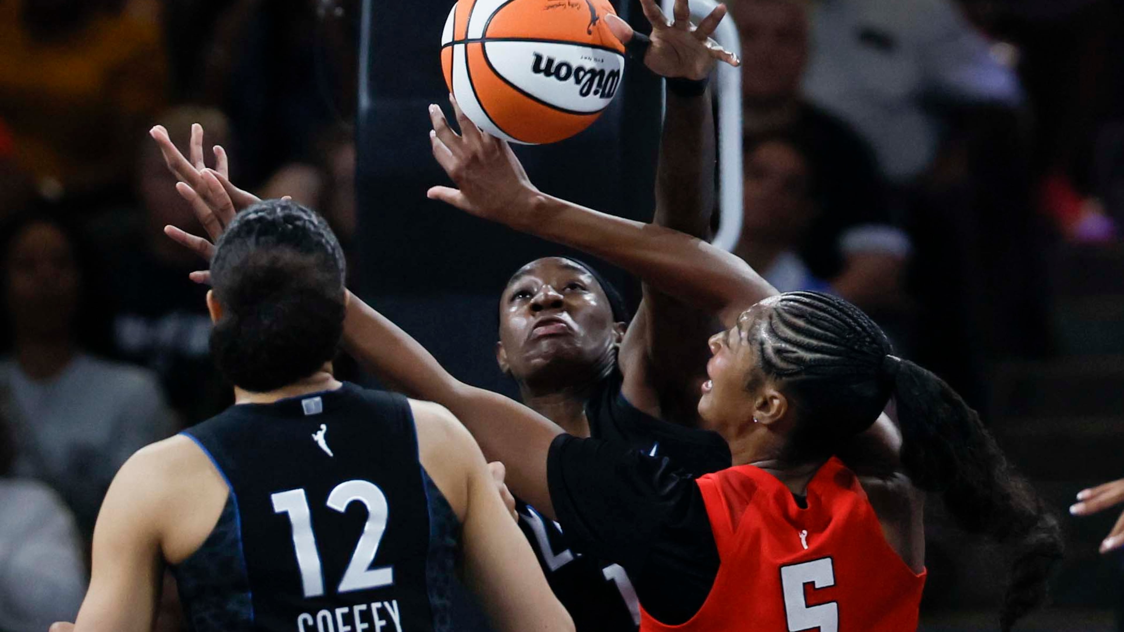 Atlanta Dream forward Angel Reese (5) battles for a rebound against Minnesota Lynx forward Natasha Howard (1) during the second half of a WNBA game at Gateway Center Arena on Sunday, August 30, 2026, in Atlanta. (Miguel Martinez/ AJC)