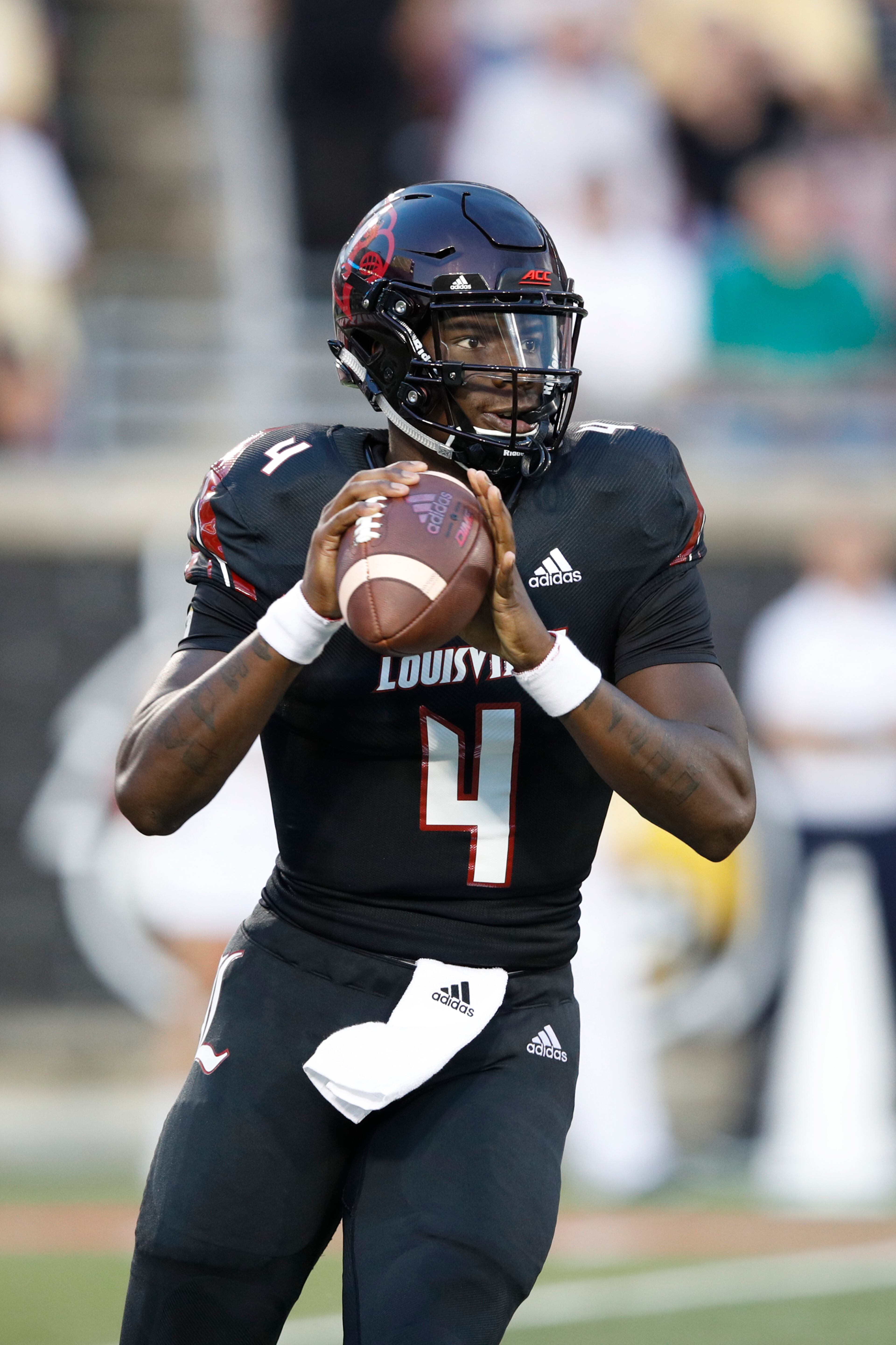 LOUISVILLE, KY - OCTOBER 05: Jawon Pass #4 of the Louisville Cardinals looks to pass the ball in the first half of the game against the Georgia Tech Yellow Jackets at Cardinal Stadium on October 5, 2018 in Louisville, Kentucky. (Photo by Joe Robbins/Getty Images)