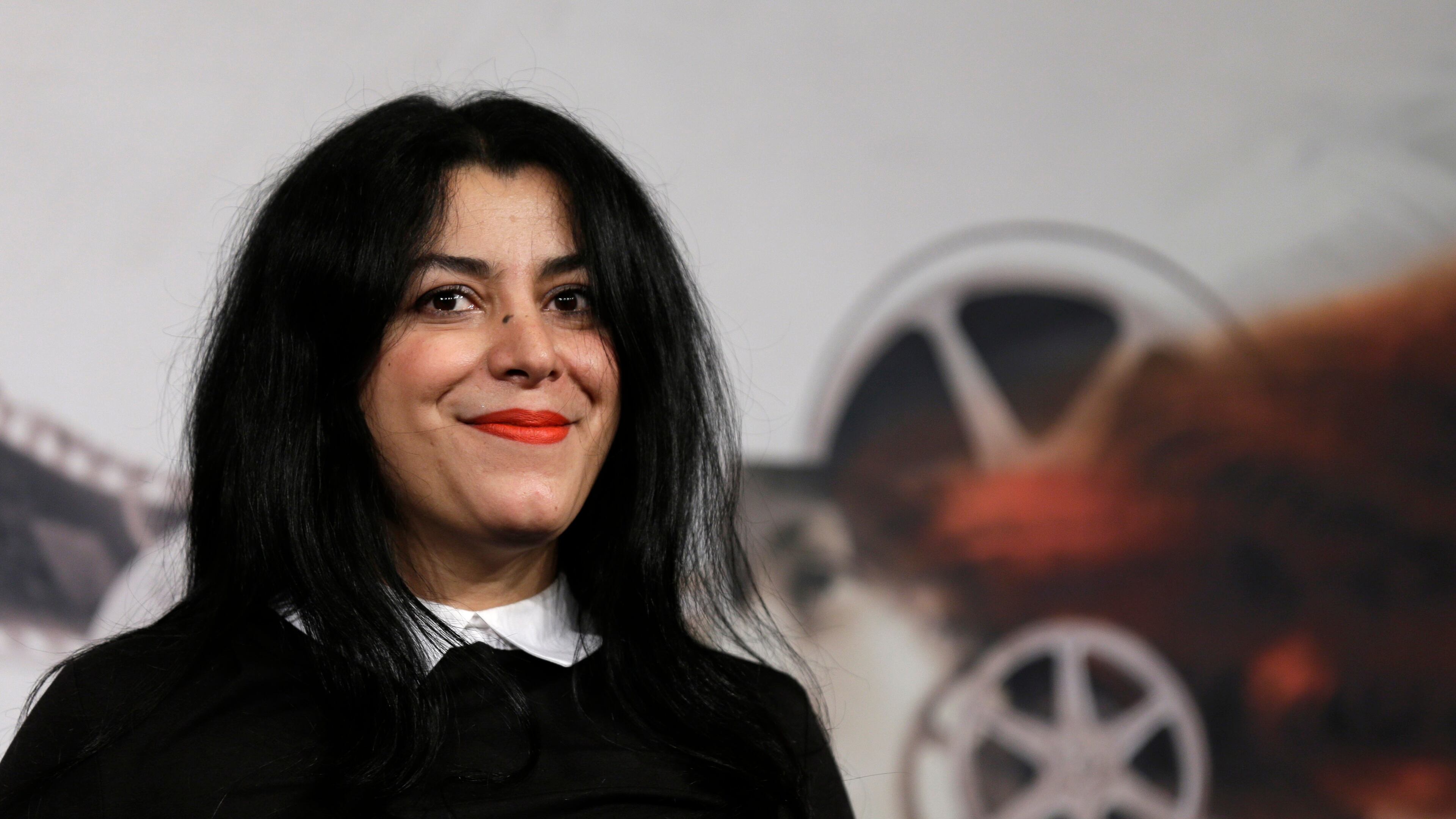 FILE - Director, illustrator and author Marjane Satrapi poses for photographers as she arrives to present the movie "La Bande des Jotas" at the 7th edition of the Rome International Film Festival in Rome, on Nov. 16, 2012. (AP Photo/Alessandra Tarantino, File)