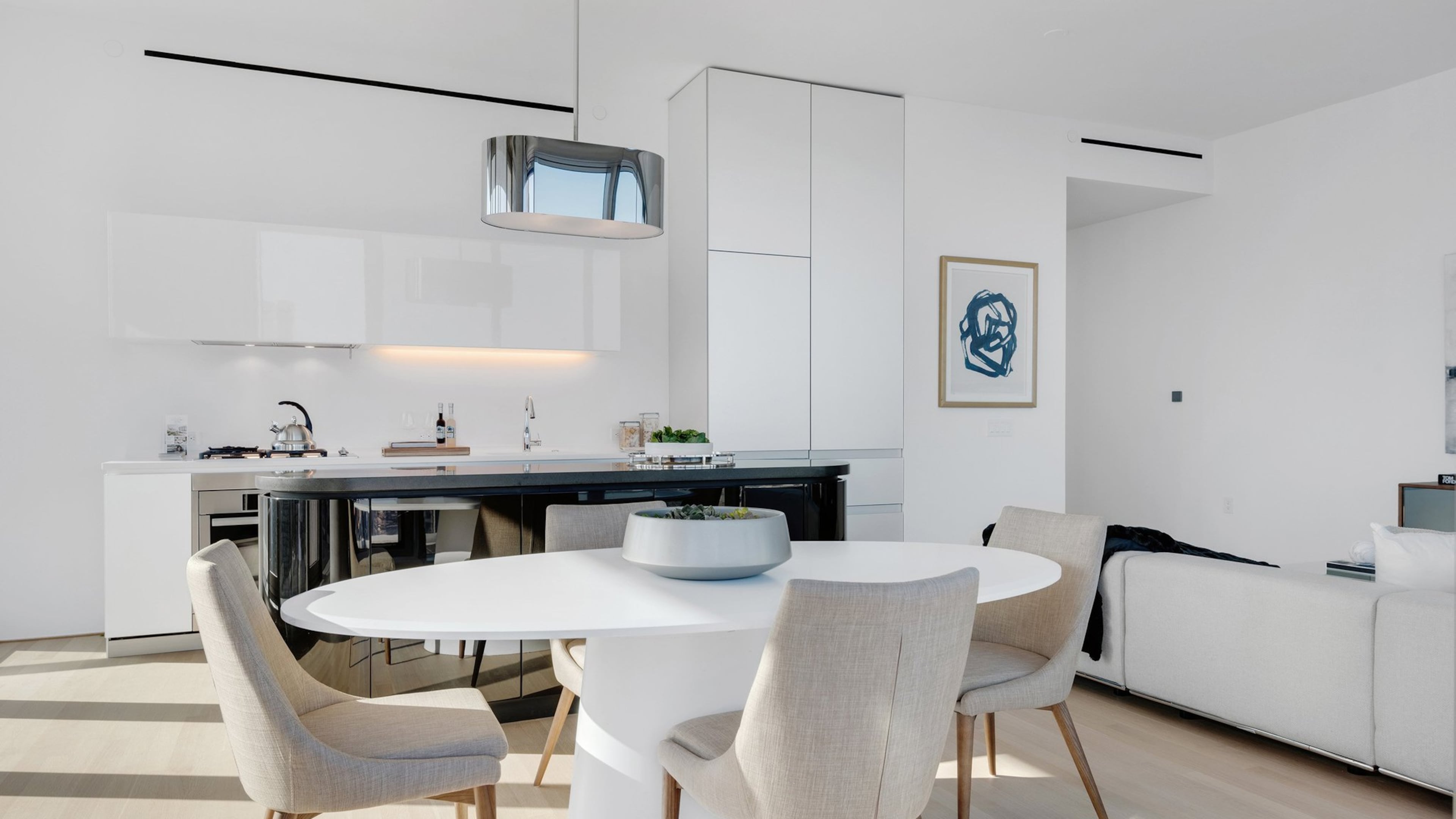 White furniture helps create a monochromatic color palette in this living room. (Design Recipes)