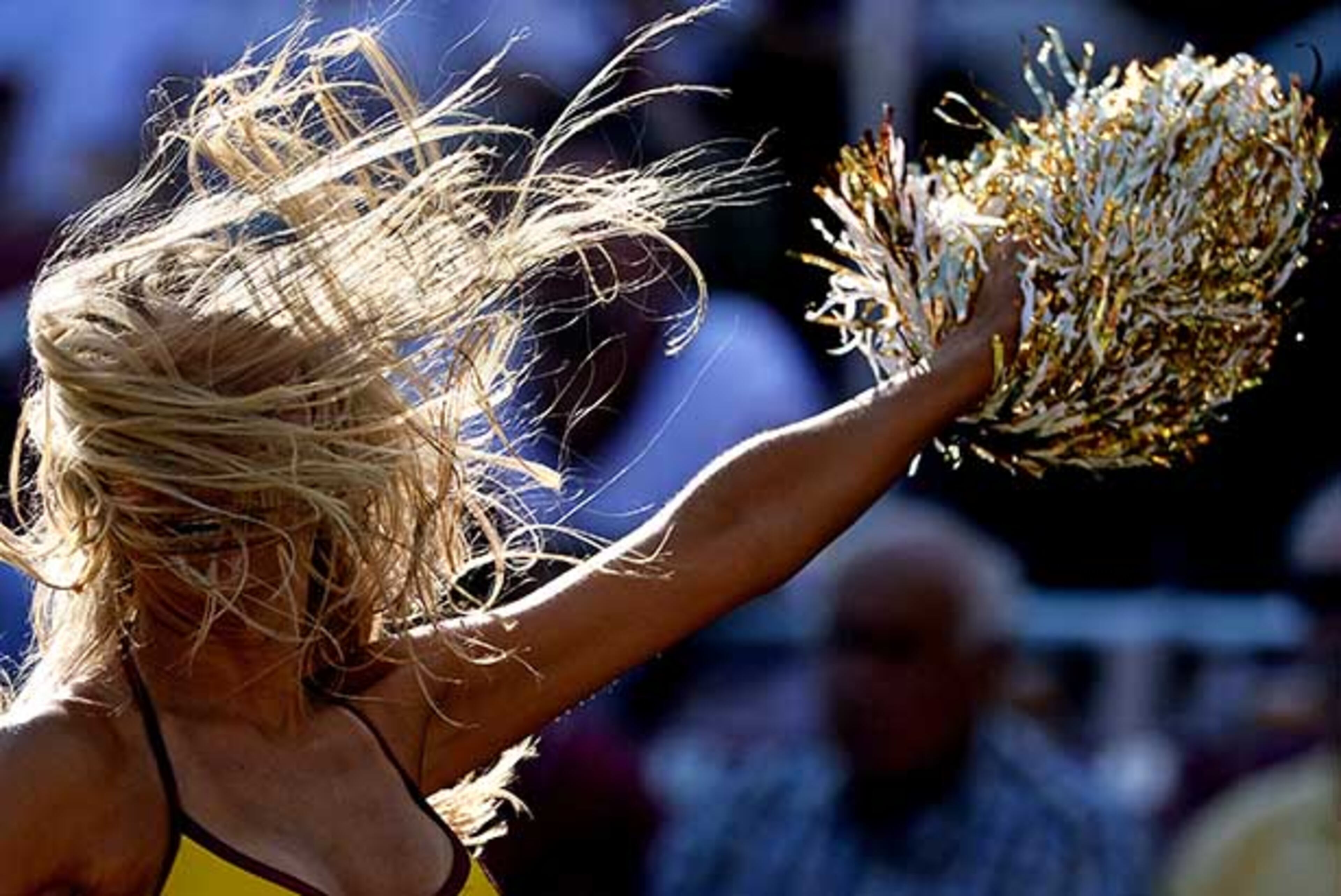 LANDOVER, MD - AUGUST 24: A Washington Redskins cheerleader dances during a timeout during an NFL game between the Washington Redskins and the Buffalo Bills during a preseason game at FedExField on August 24, 2013 in Landover, Maryland. The Washington Redskins won, 30-7. (Photo by Patrick Smith/Getty Images)