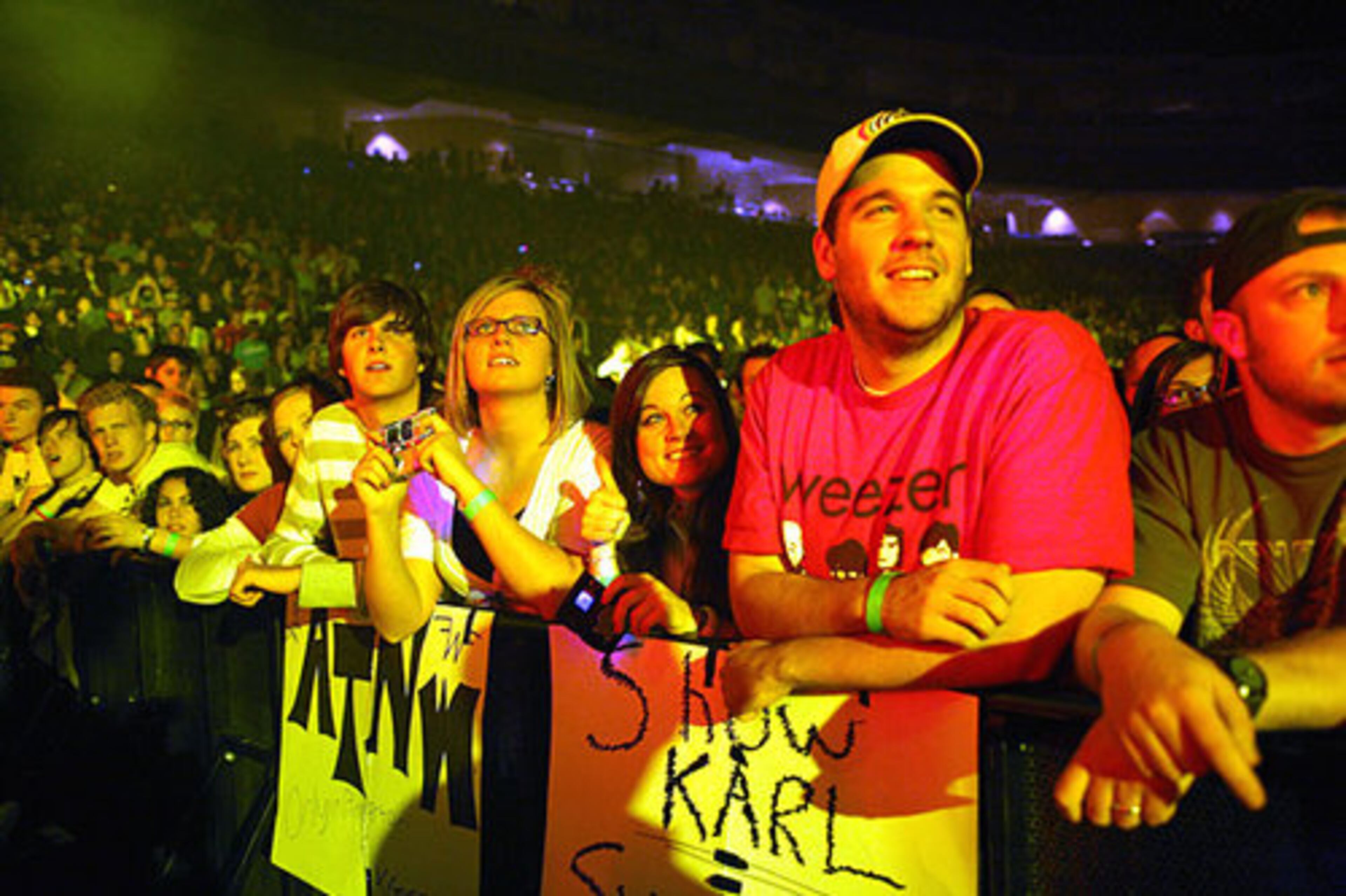 These Weezer fans are from Newnan: From left, Phillip Sykes, Mallory Gray, Amanda Digan and Garrett Linderman. The ATNW sign stands for All Things Not Weezer.