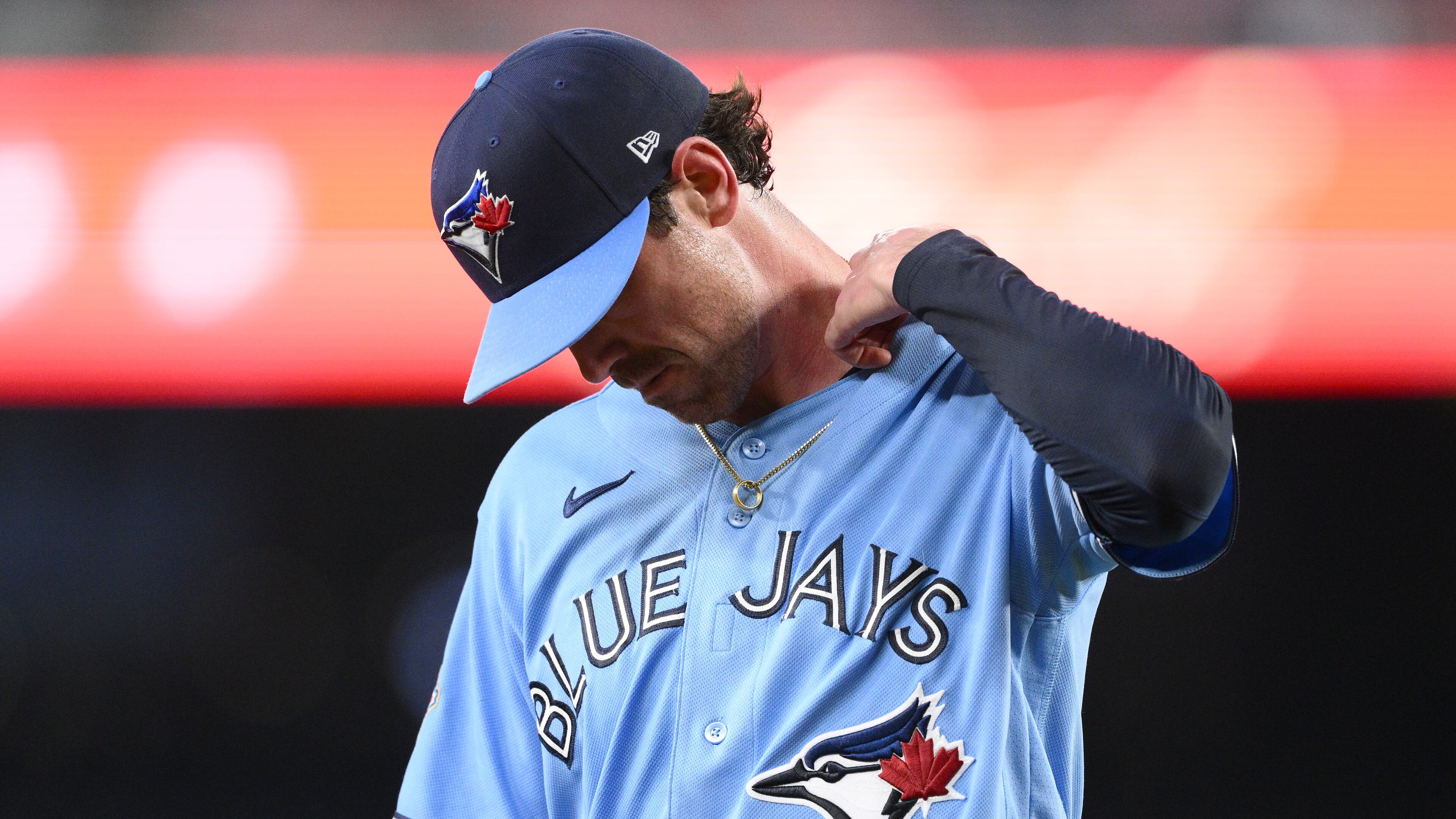 Toronto Blue Jays pitcher Shane Bieber walks back to the dugout after he was pulled from a baseball game in the first inning against the Washington Nationals, Tuesday, July 28, 2026, in Washington. (AP Photo/Nick Wass)