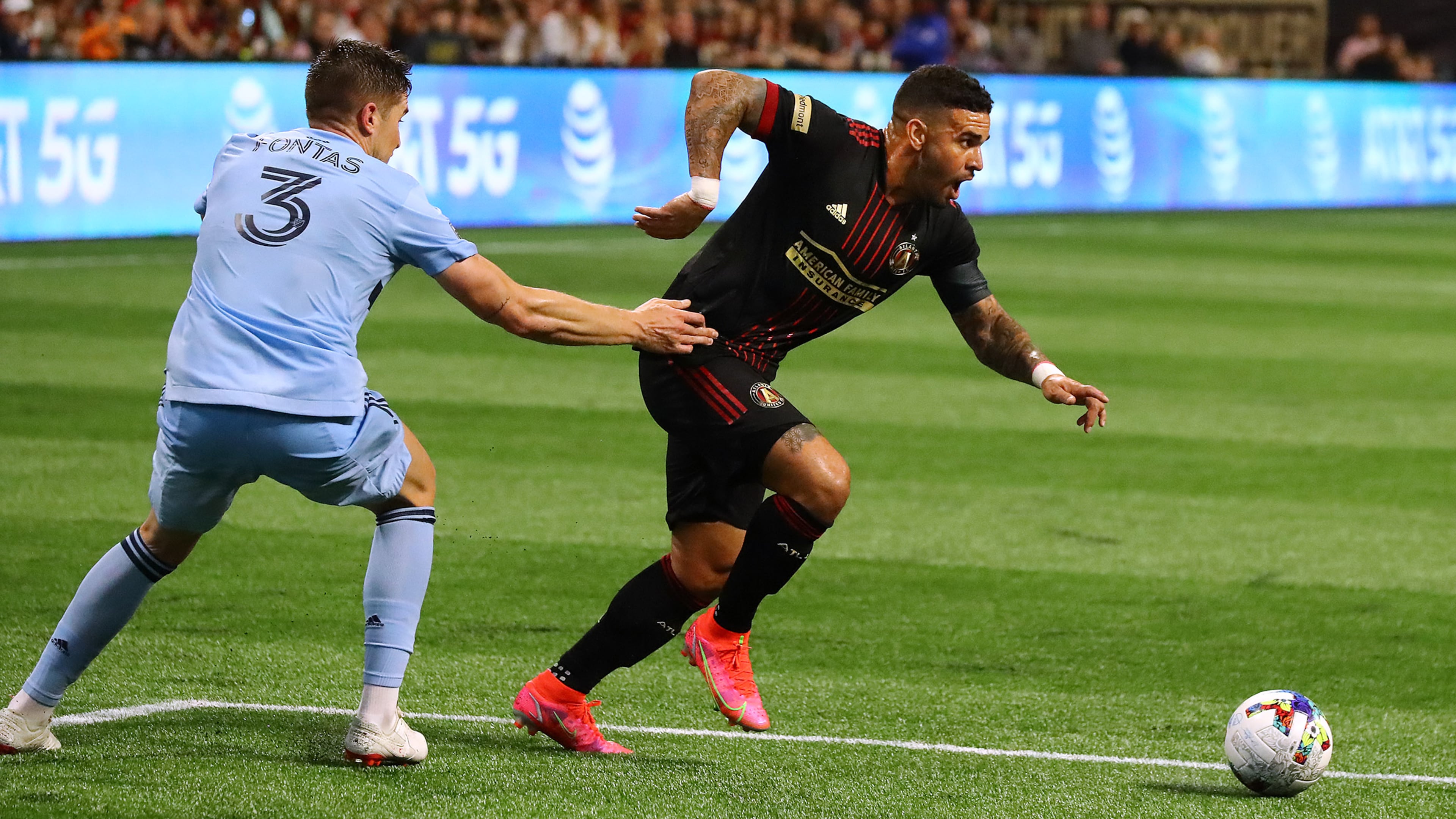 022722 : Atlanta United attacker Dom Dwyer gets past Sporting KC defender Andreu Fontas to score a goal for a 2-0 lead in a MLS soccer match on Sunday, Feb. 27, 2022, in Atlanta. “Curtis Compton / Curtis.Compton@ajc.com”`
