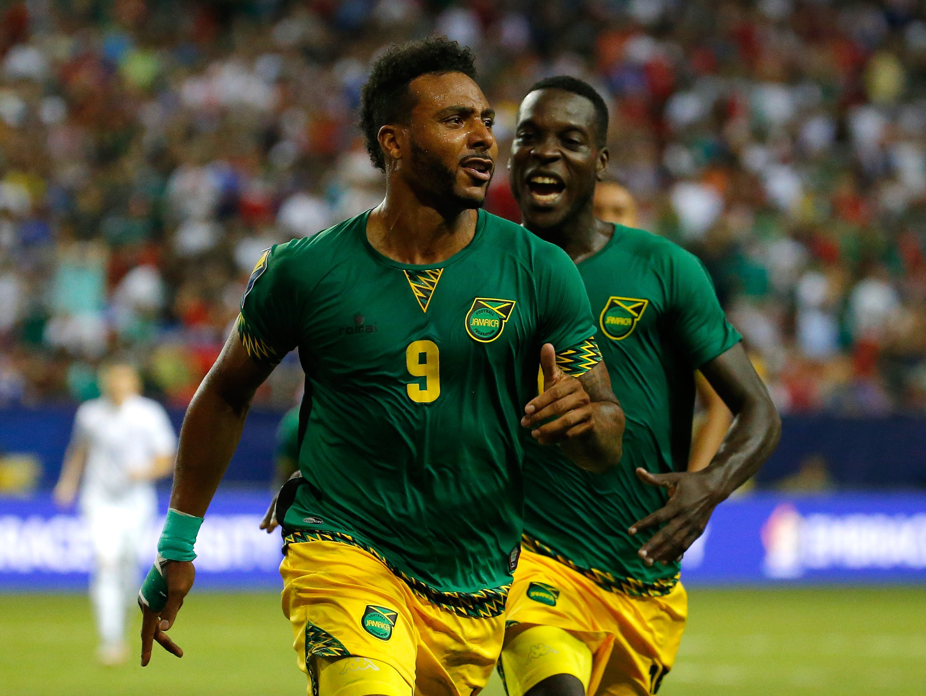 Giles Barnes #9 of Jamaica celebrates scoring the second goal against the United States of America with Je-Vaughn Watson #15 during the 2015 CONCACAF Golf Cup Semifinal match between Jamaica and the United States at Georgia Dome on July 22, 2015 in Atlanta, Georgia. (Photo by Kevin C. Cox/Getty Images)