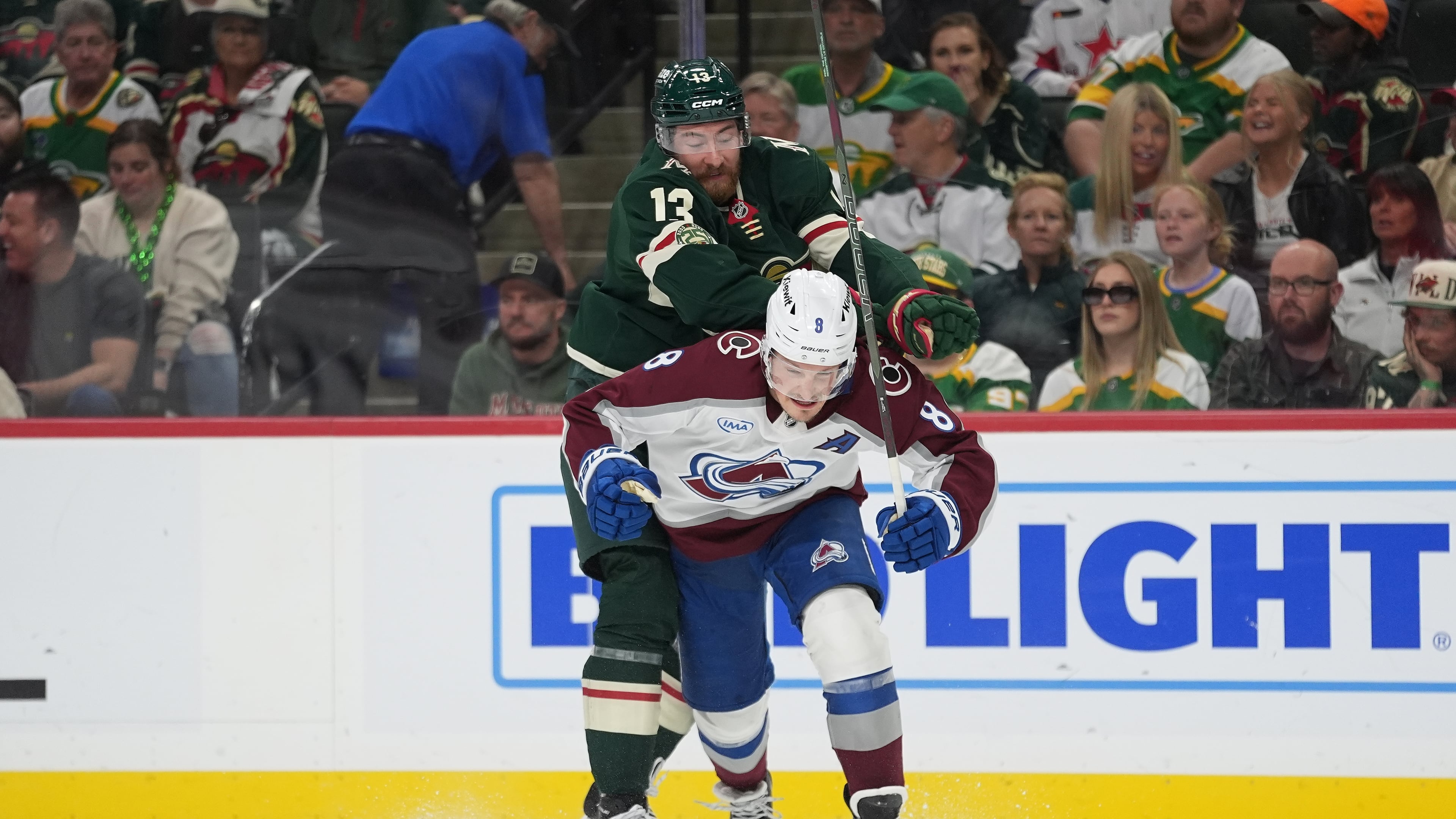Minnesota Wild center Yakov Trenin (13) pushes Colorado Avalanche defenseman Cale Makar (8) during the first period of Game 4 in a second-round NHL hockey Stanley Cup playoff series Monday, May 11, 2026, in St. Paul, Minn. (AP Photo/Abbie Parr)